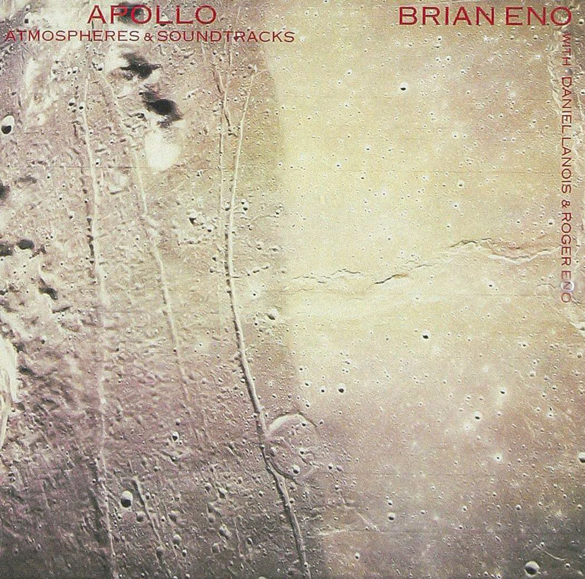 Album cover of 'Apollo Atmospheres & Soundtracks' by Brian Eno, showing a textured lunar or planetary surface with craters and a dark streak, with red and pink text in the top left and right corners.