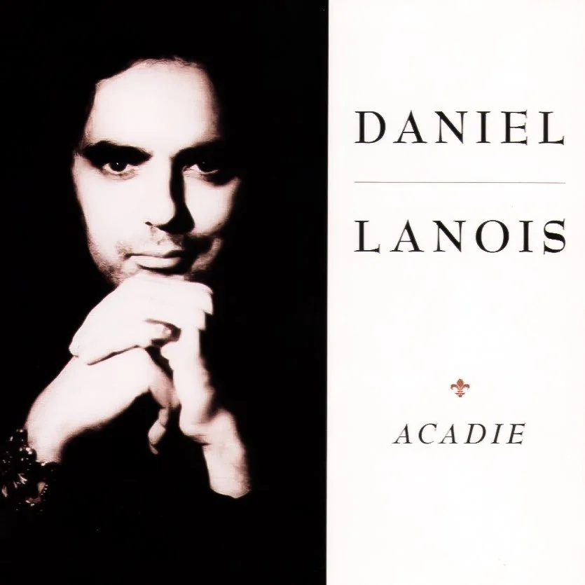 Book cover featuring a black and white portrait of Daniel Lanois with his hand near his chin, next to the title 'Daniel Lanois' and the word 'Acadiana' at the bottom.