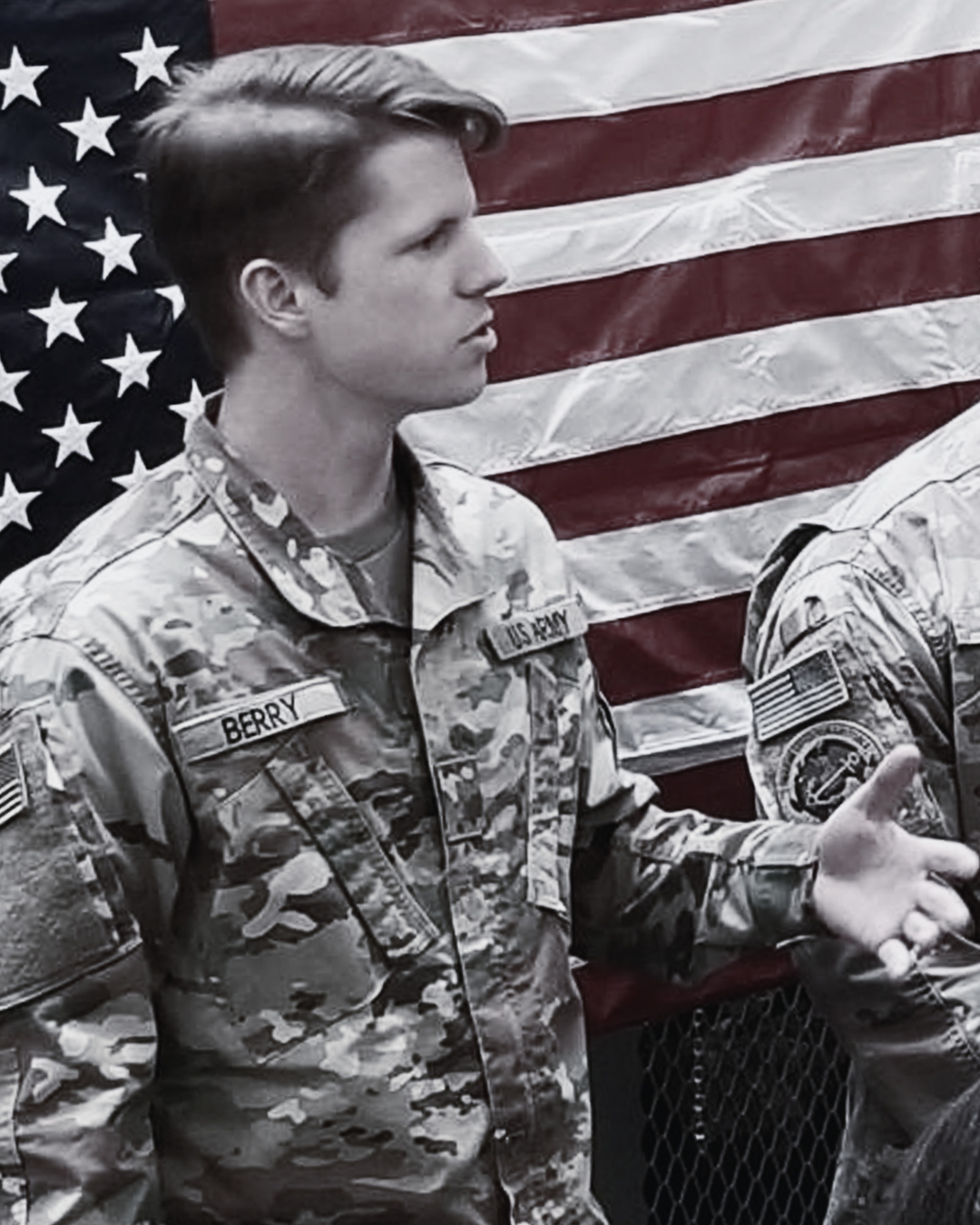 Sentinel Consulting Group Founder leading an operational briefing in military uniform in front of the US flag.