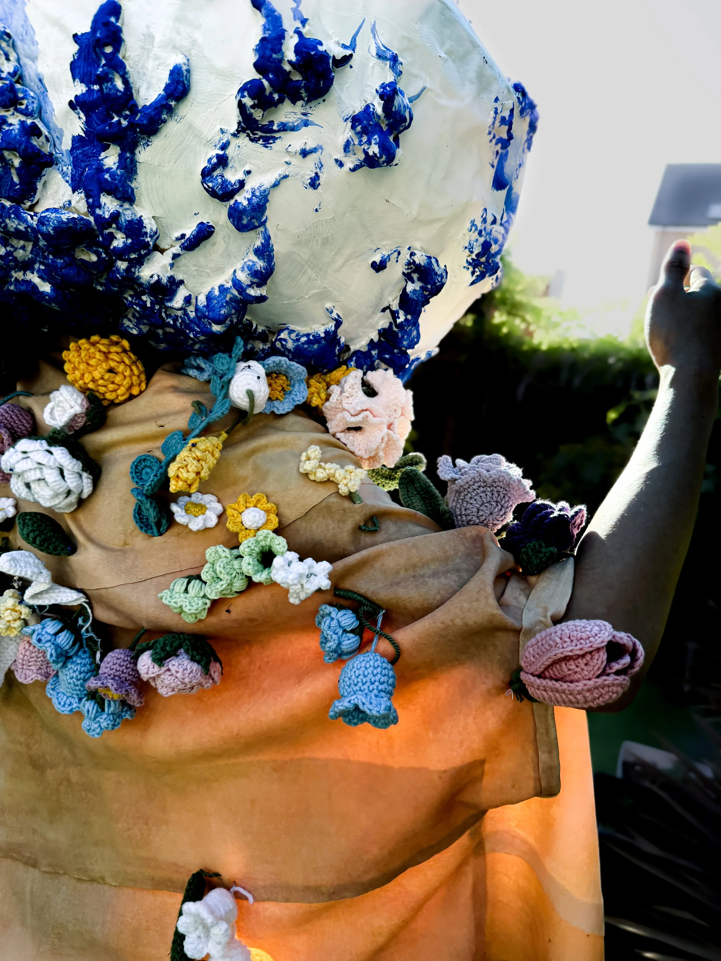 Piercing (2025) by Marco Yuen and Mei Leung, Crochet and latex cloak, with paper, foam and wire headwear