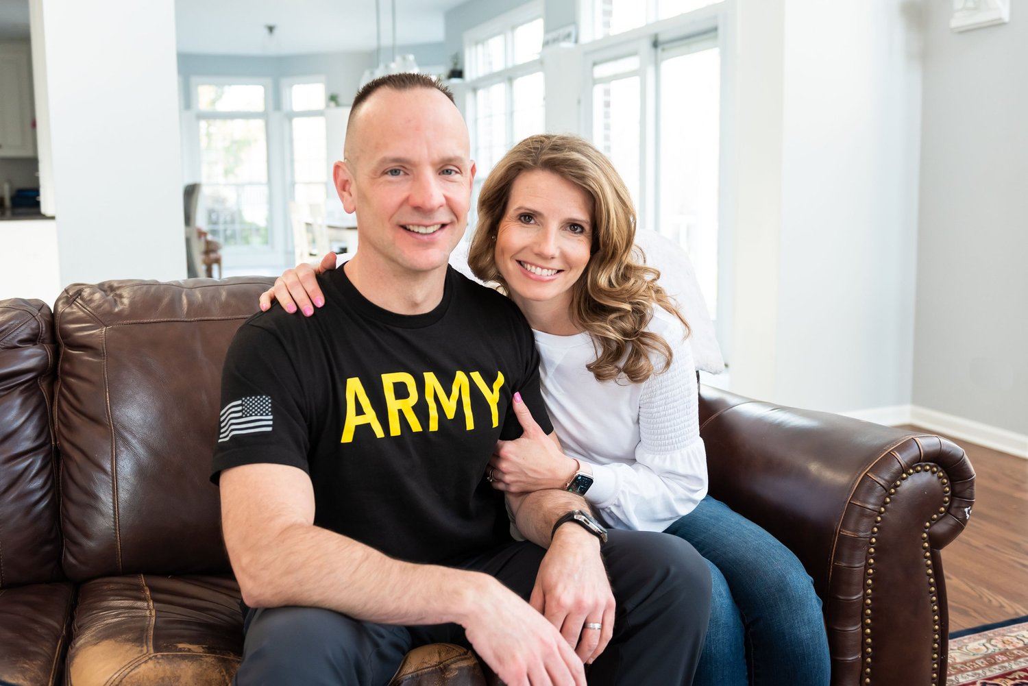 Army veteran and his wife on a couch
