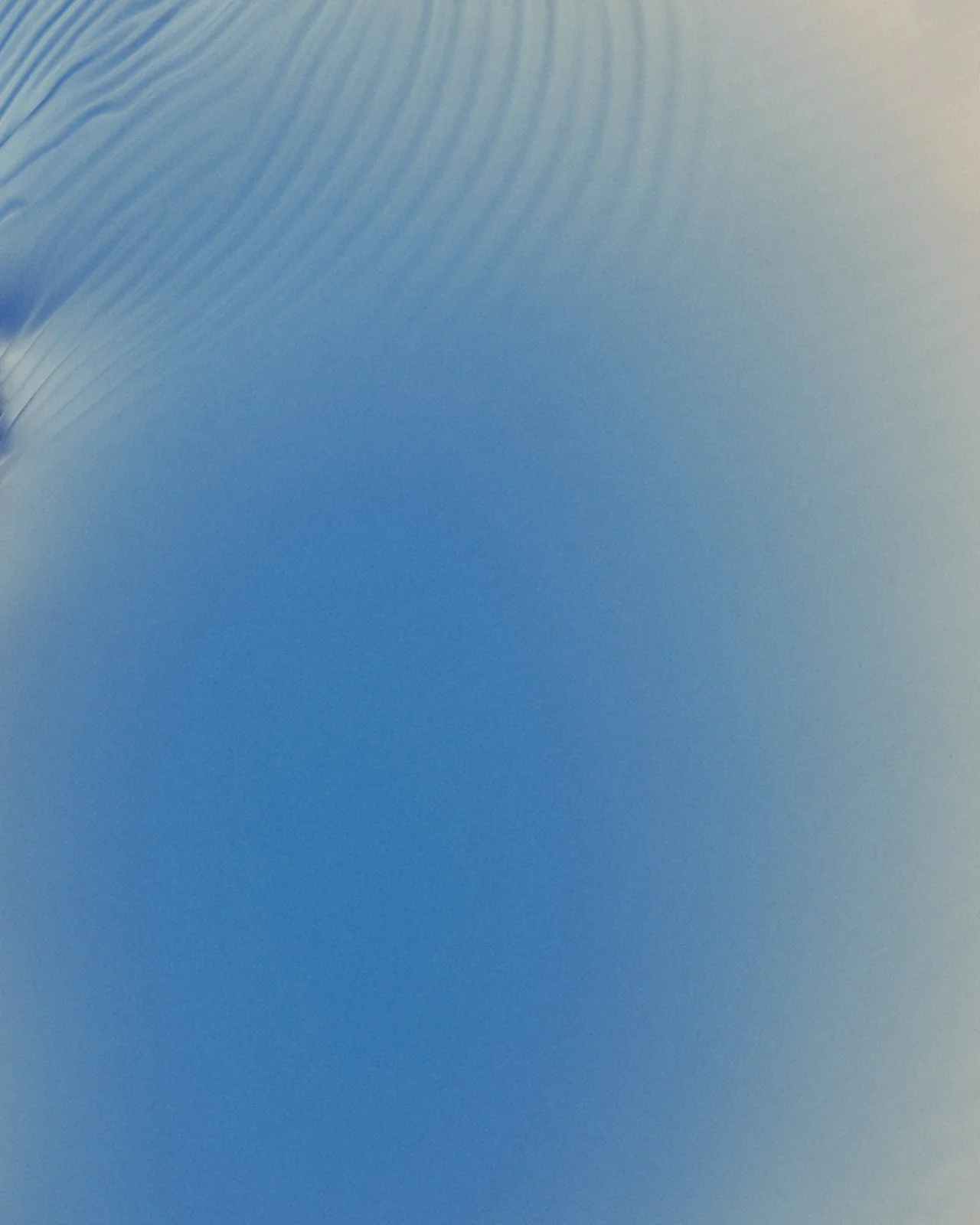 Close-up of a blue and white surface with a textured pattern, possibly part of a modern design or material.