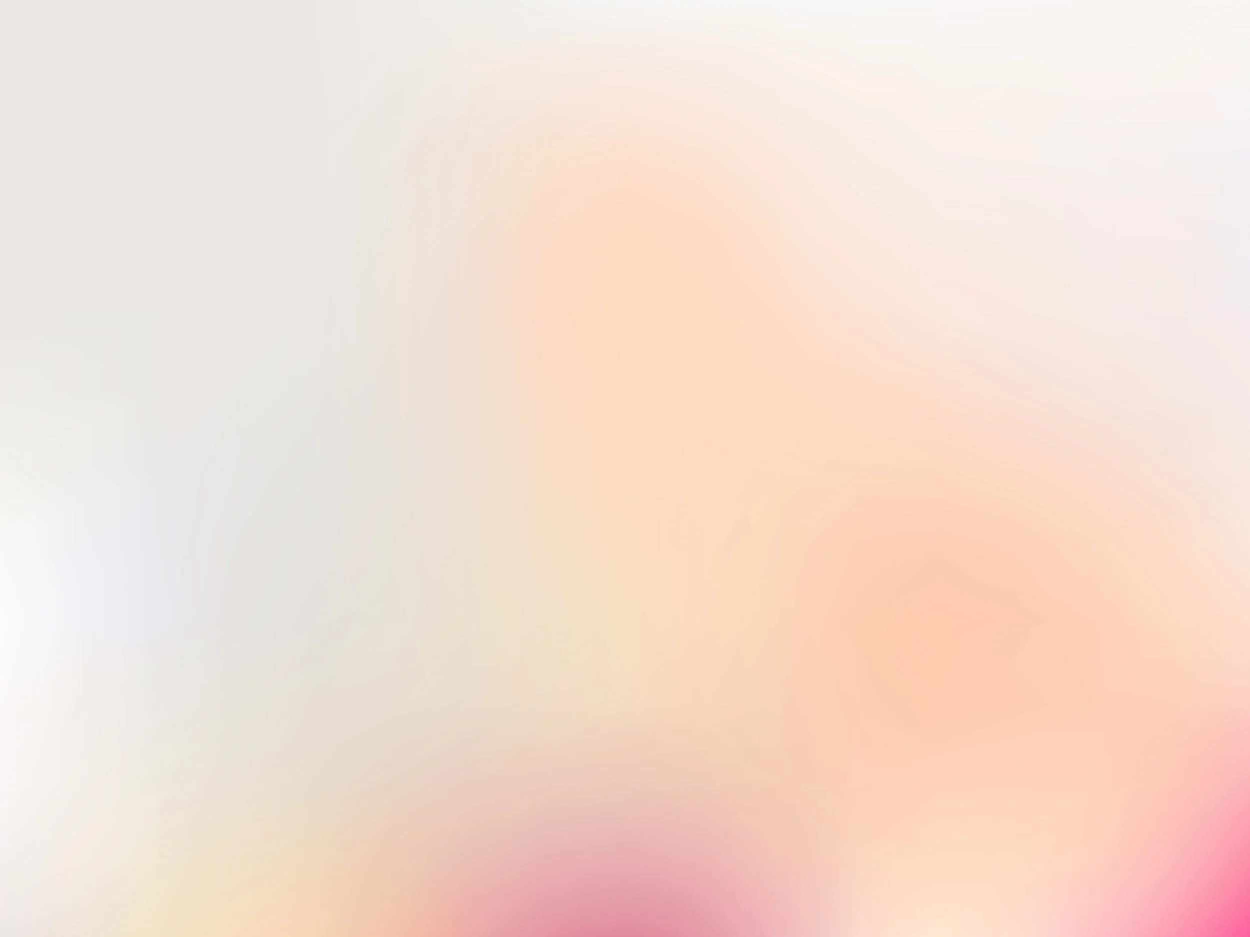 Blurred pastel background with soft pink, peach, and light gray hues.