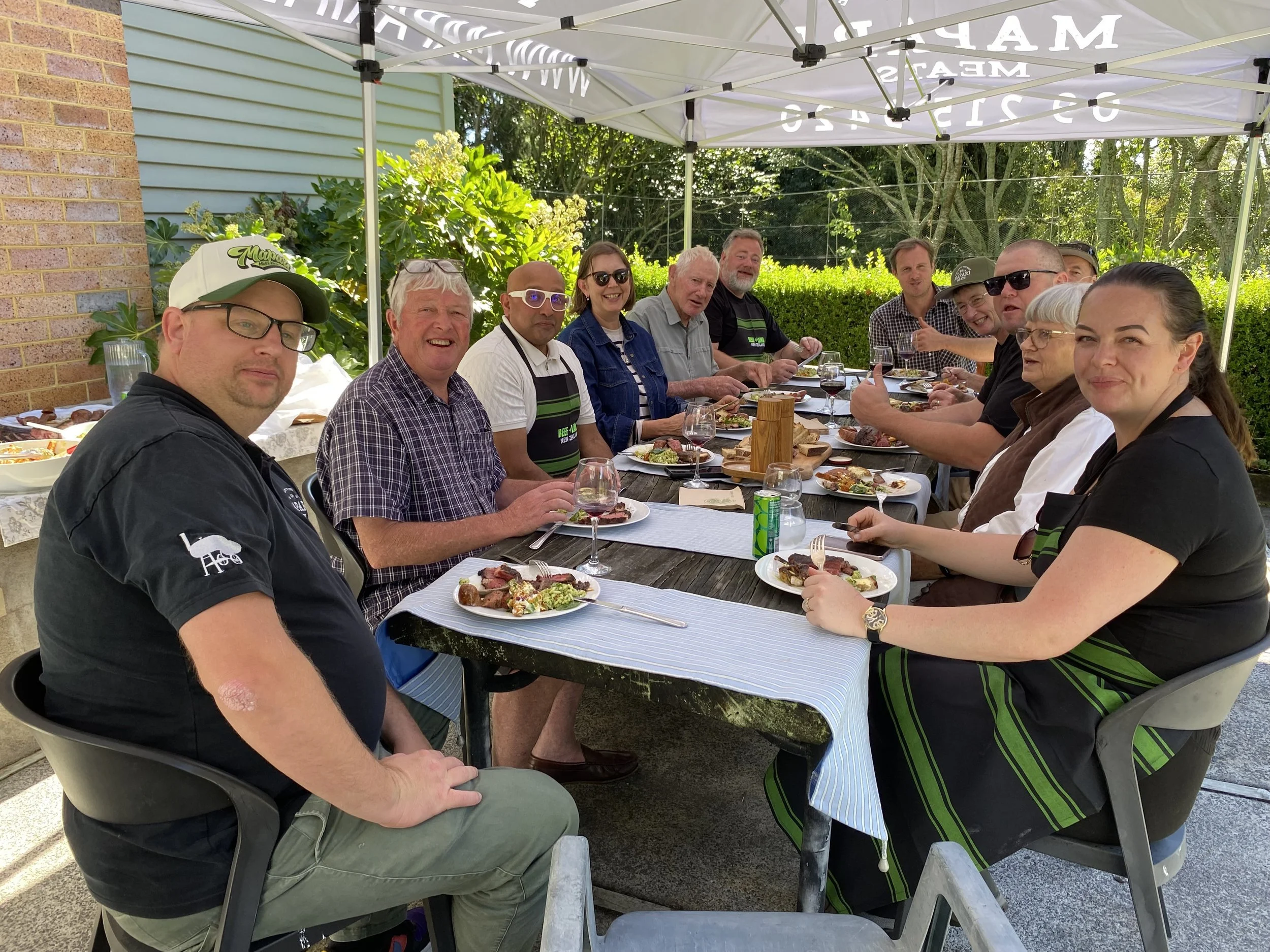 12 people around a long table for lunch