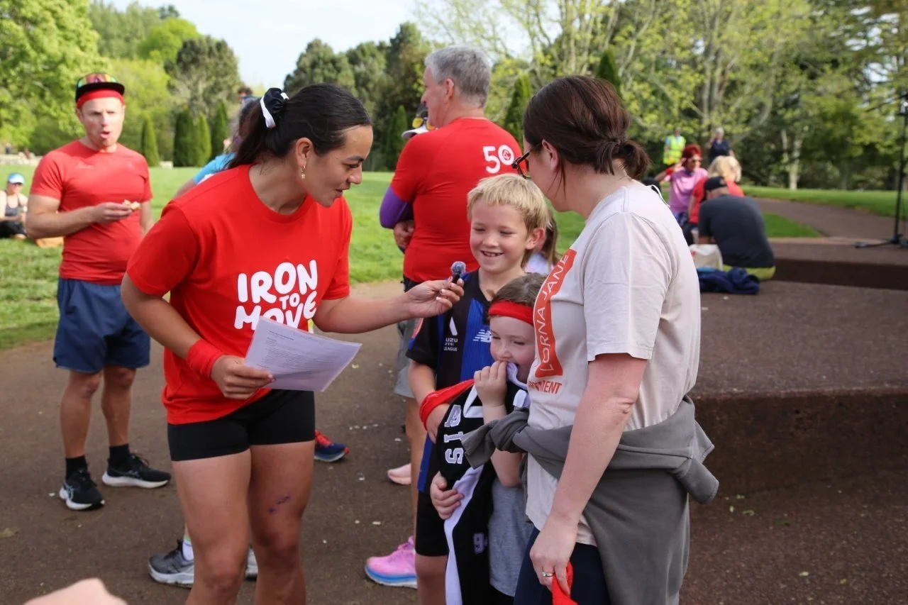 Stacey Waaka chatting with children and parents at Cronwall park after the Iron to Move run