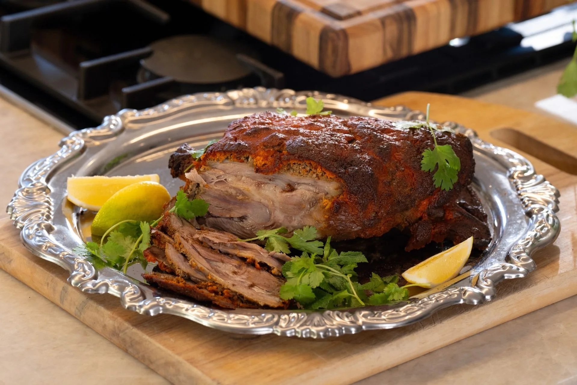 Slow-roasted Memsahib's lamb raan by Chetan Pangam on a silver platter