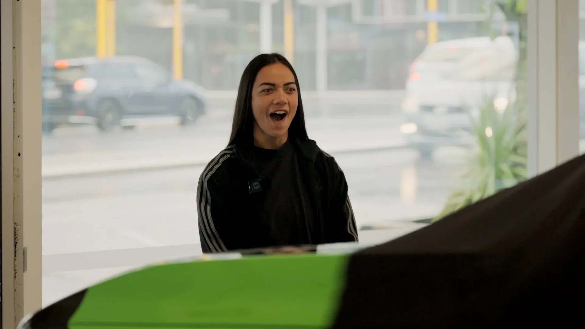 Stacey Wakka looking shocked at her new bright green lamb cruiser vehicle