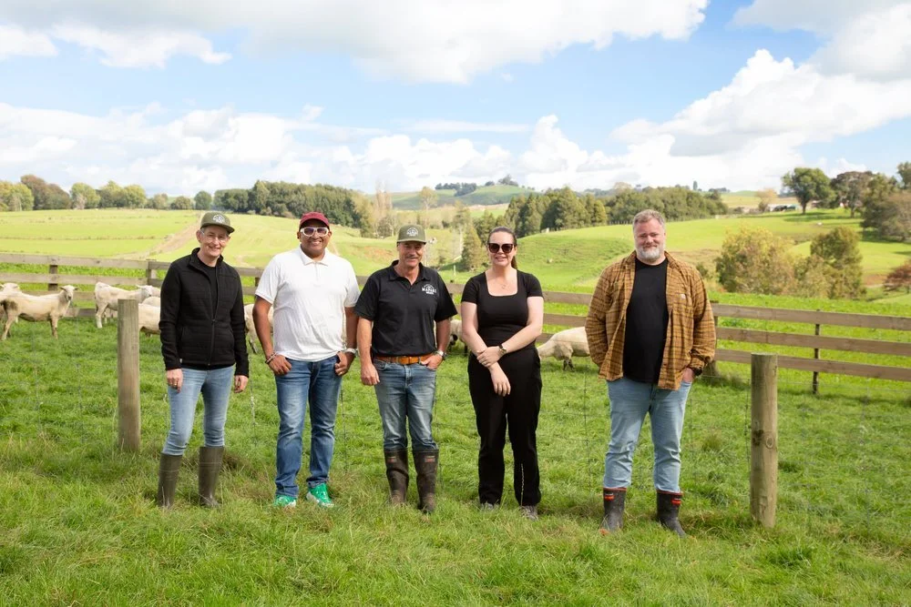 3 chefs with two farmers standing in Waikato farmland