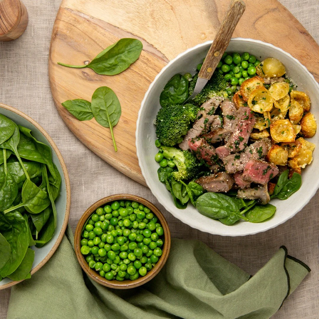 Steak Alfredo with pasta chips, peas and spinach
