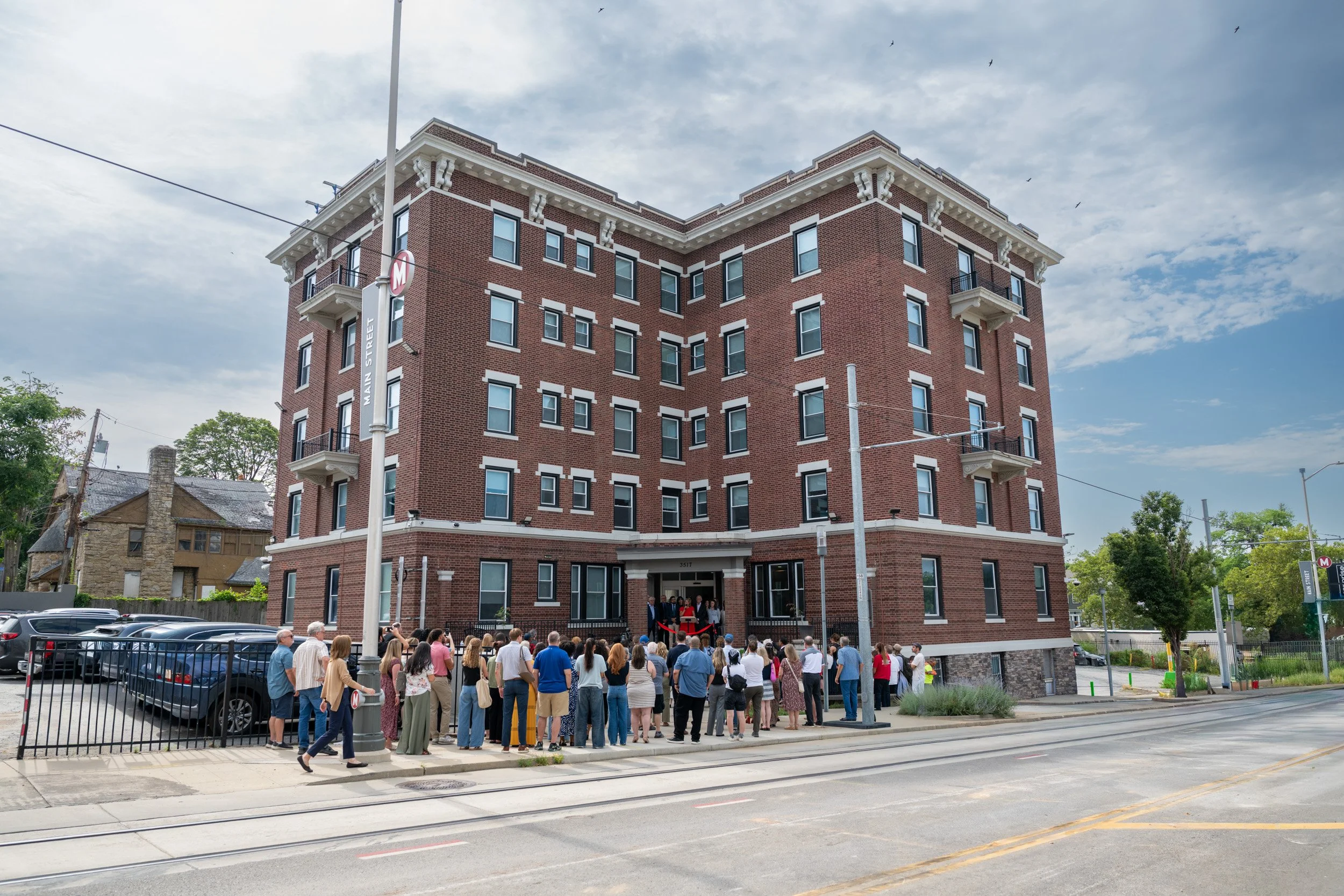Guests gathered outside the reStart Family Lodge during its grand opening celebration.