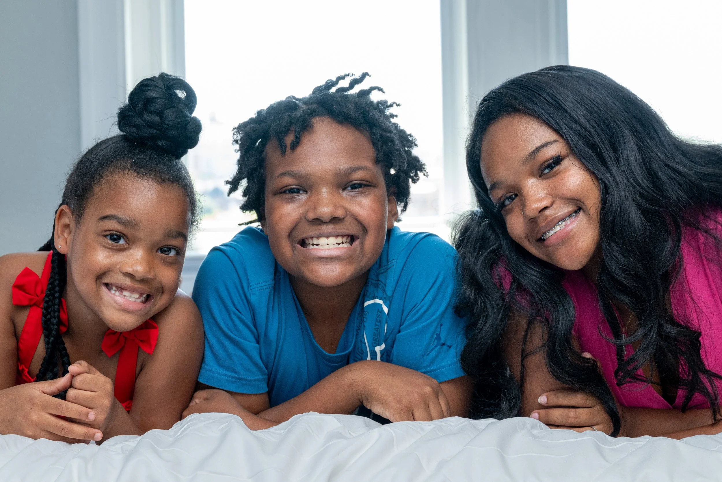 Family photographed together inside reStart's Family Lodge.