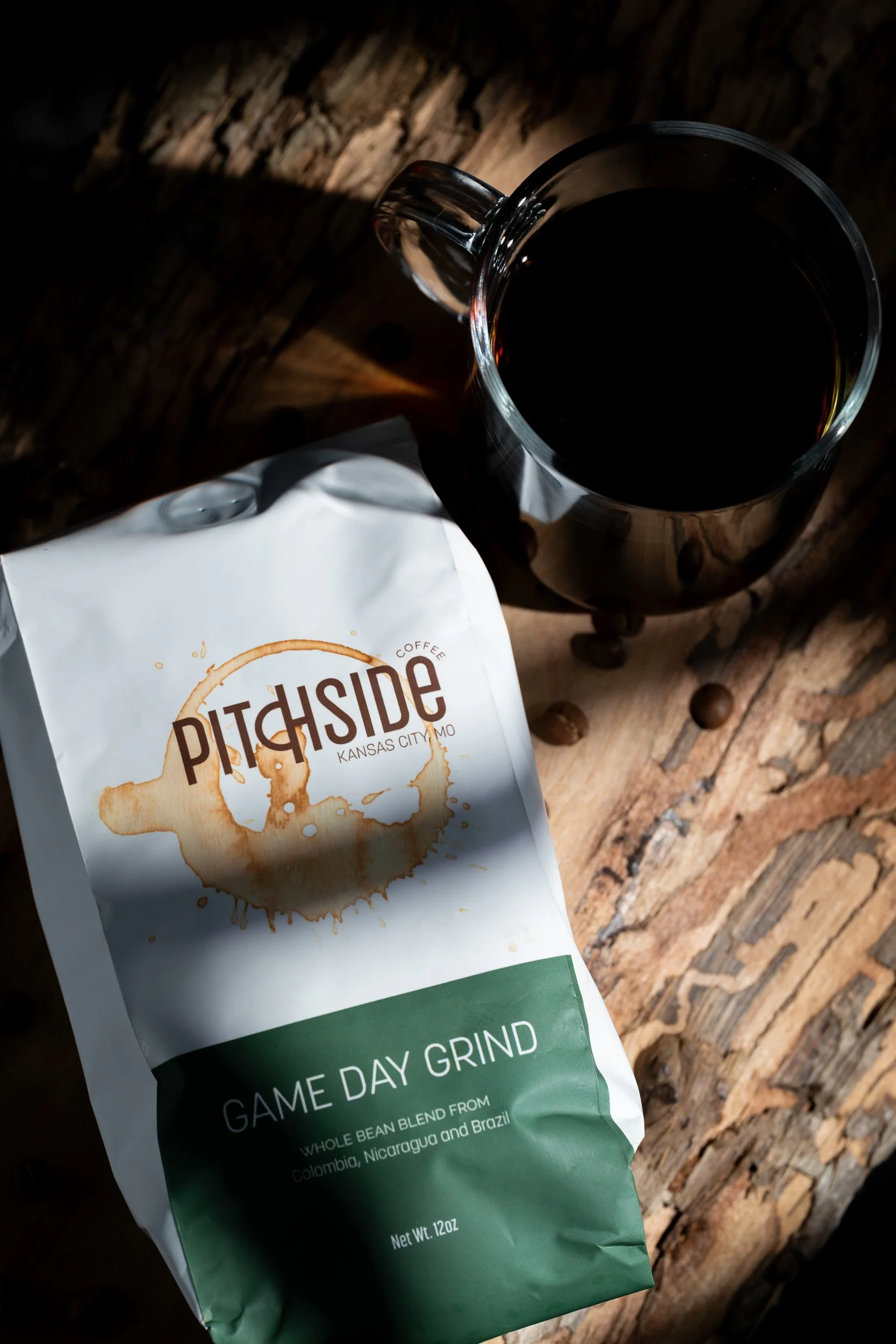 Pitchside Coffee Game Day Grind bag with coffee mug, Kansas City coffee product photography
