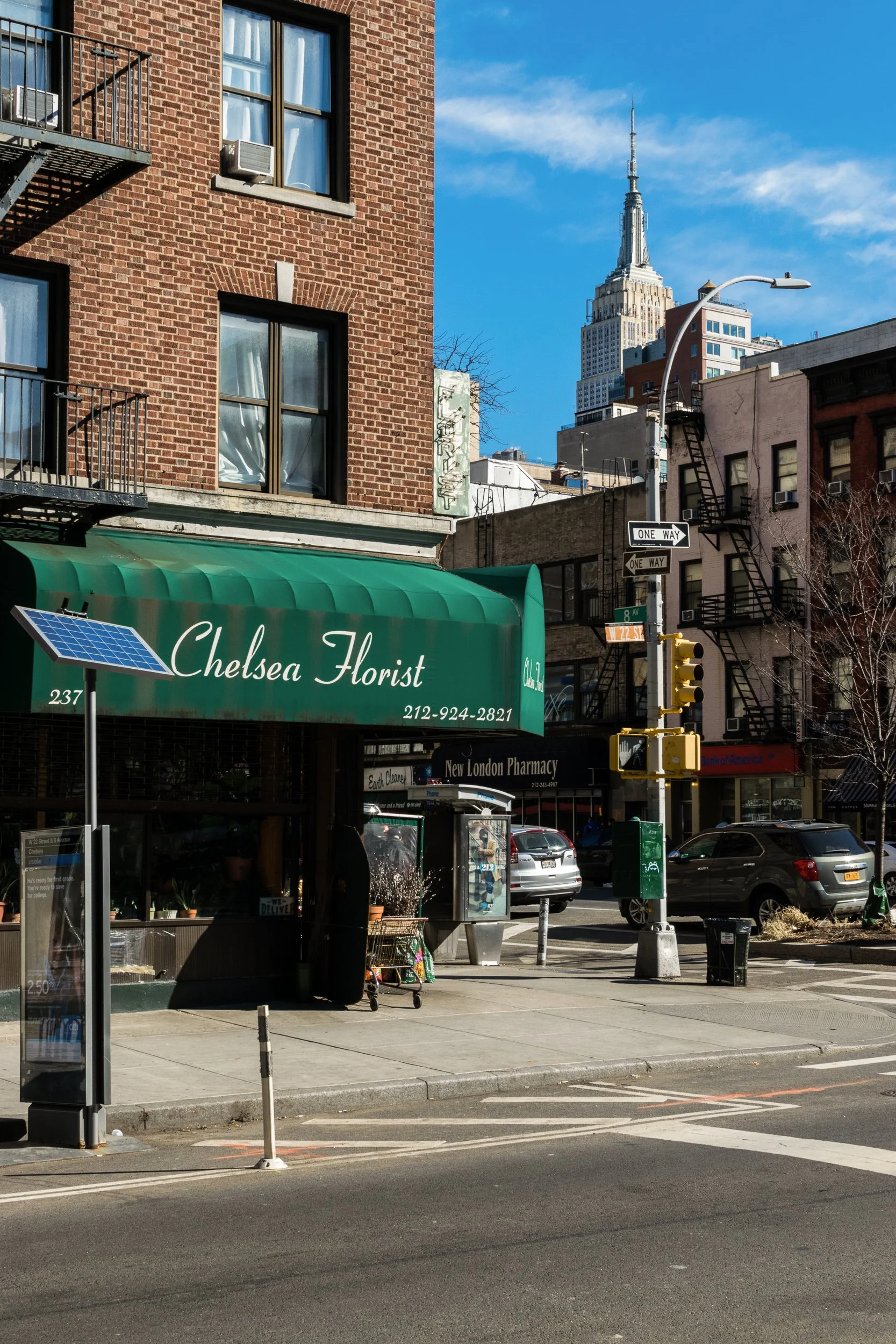 Chelsea Florist awning on a New York City street, Empire State Building visible above the roofline.
