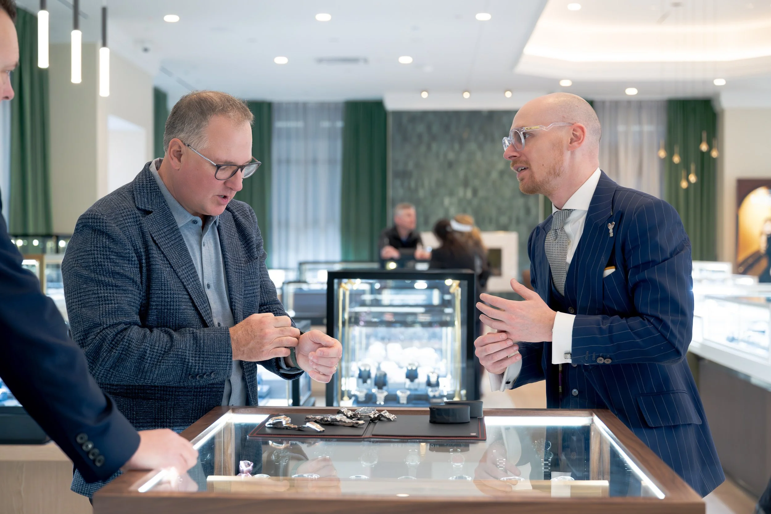 Karats Jewelers team member assisting a customer with luxury watches.