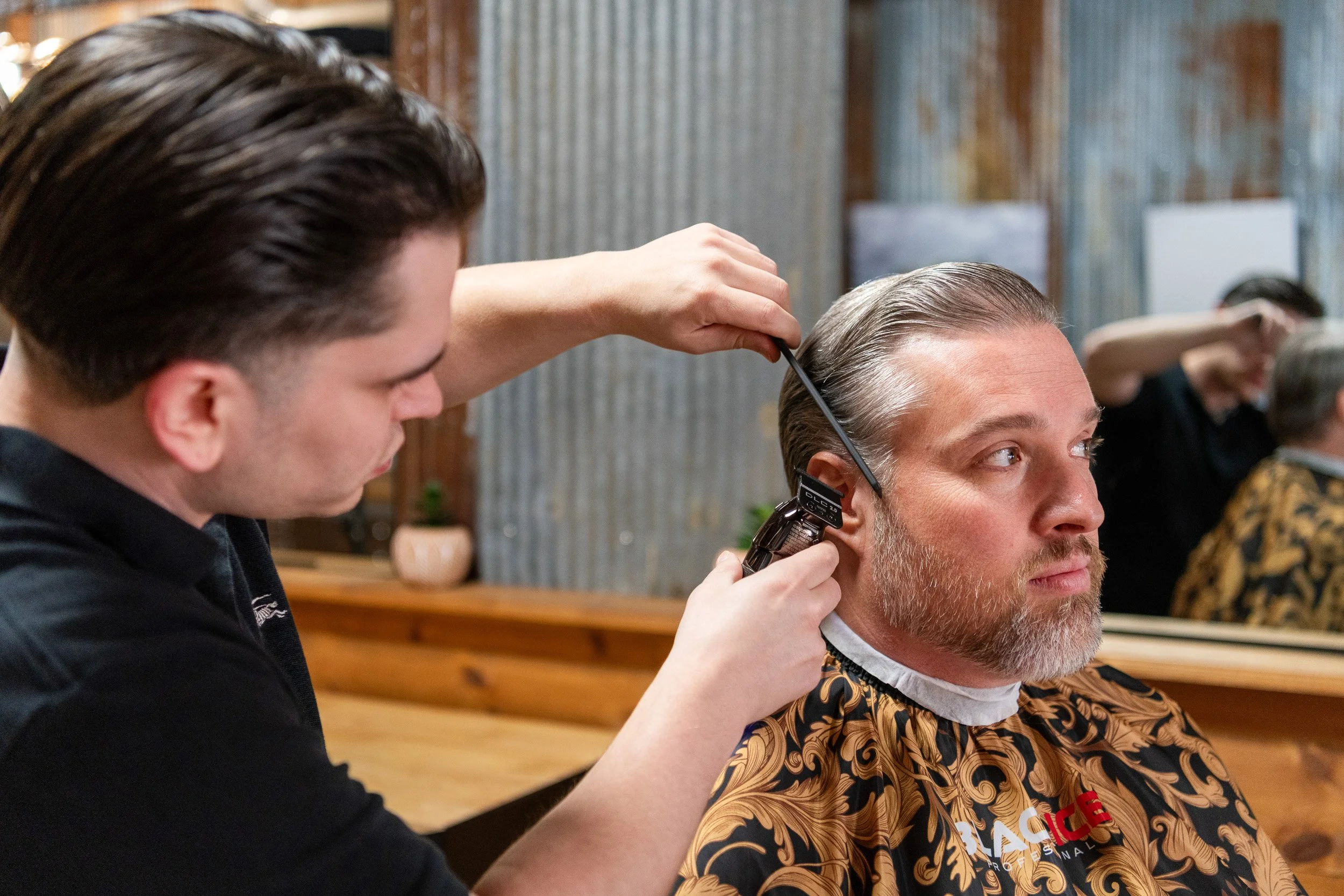 Kansas City commercial photographer Joe Zlatnik - barber cutting hair in barbershop