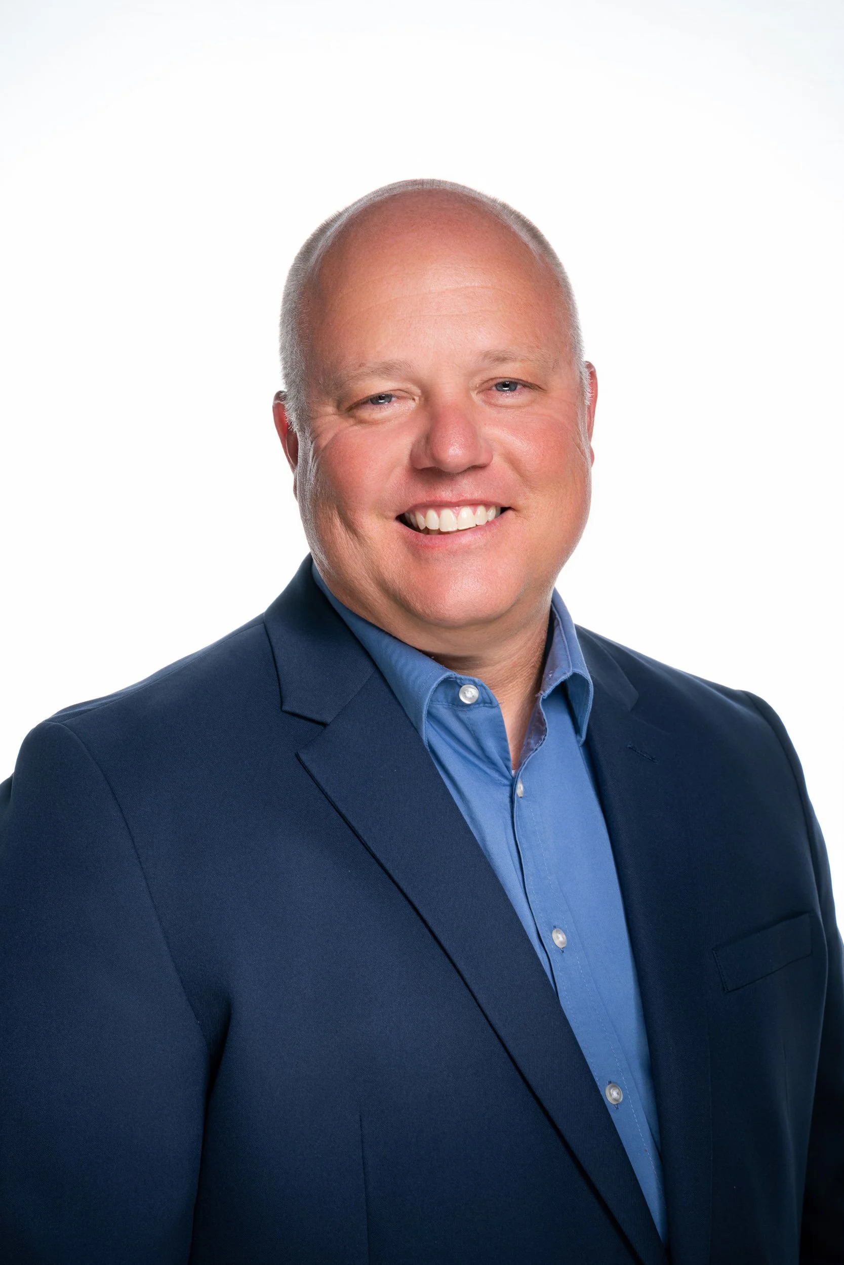 Executive headshot of KBS Constructors President Matt in a blue suit.