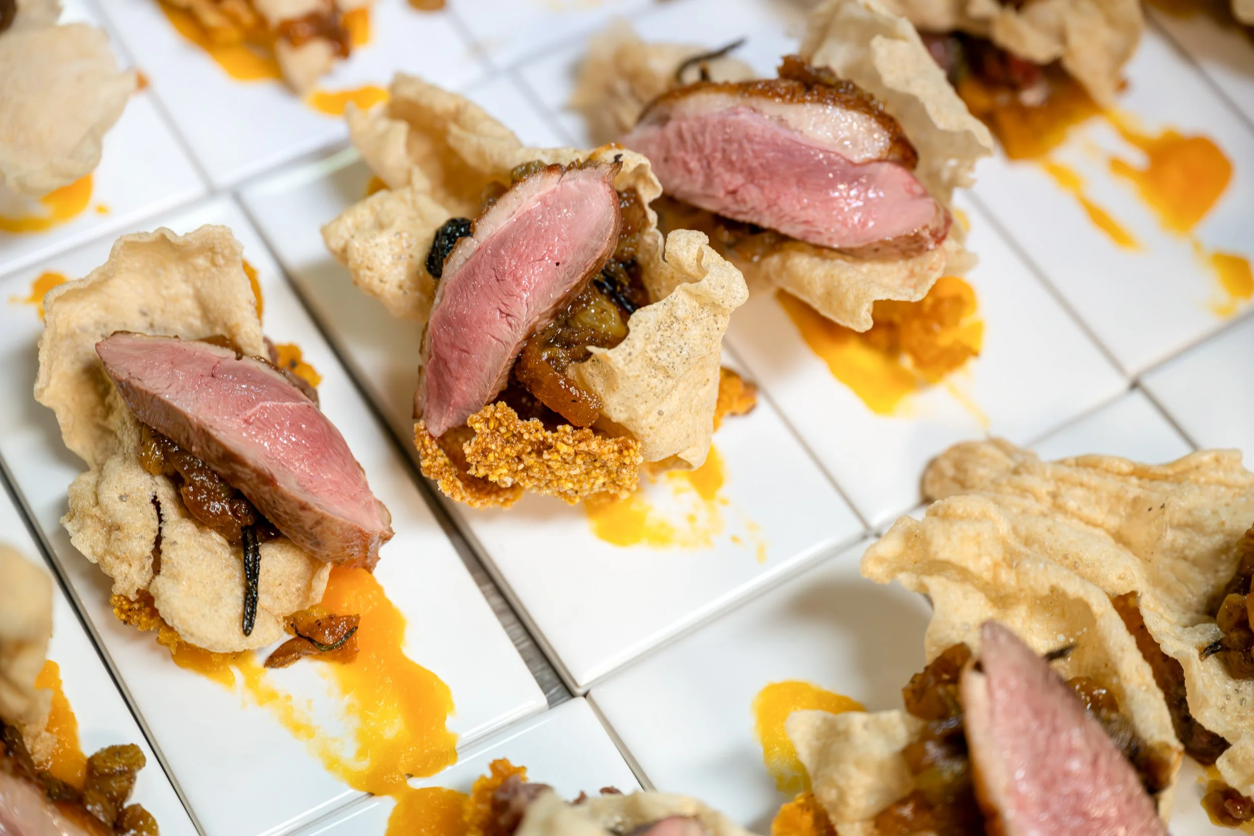 Chef-prepared duck course served during a KMRA Tasting Club dinner.