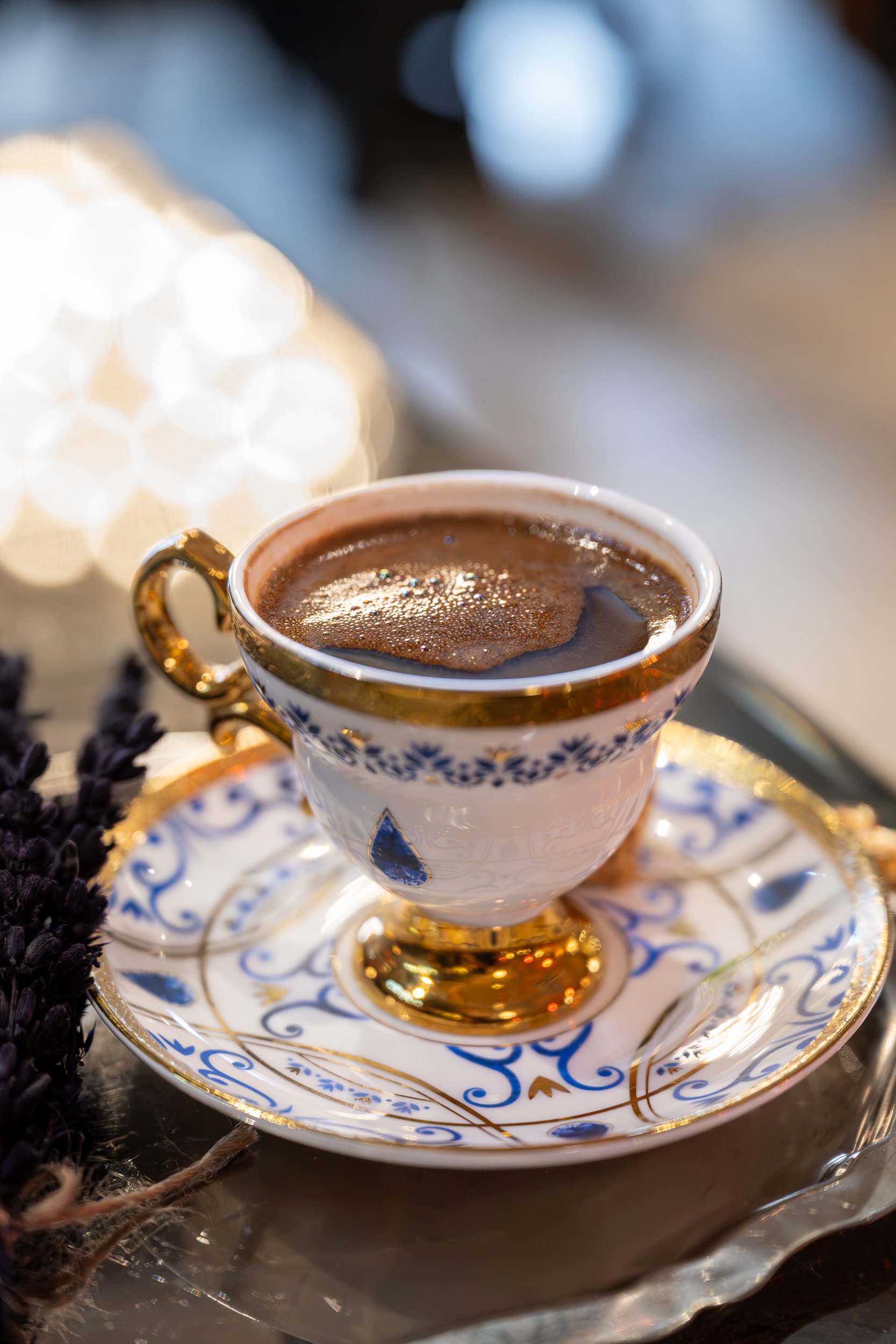 An ornate cup of Turkish coffee sits in soft window light, celebrating ritual, craftsmanship, and quiet moments.