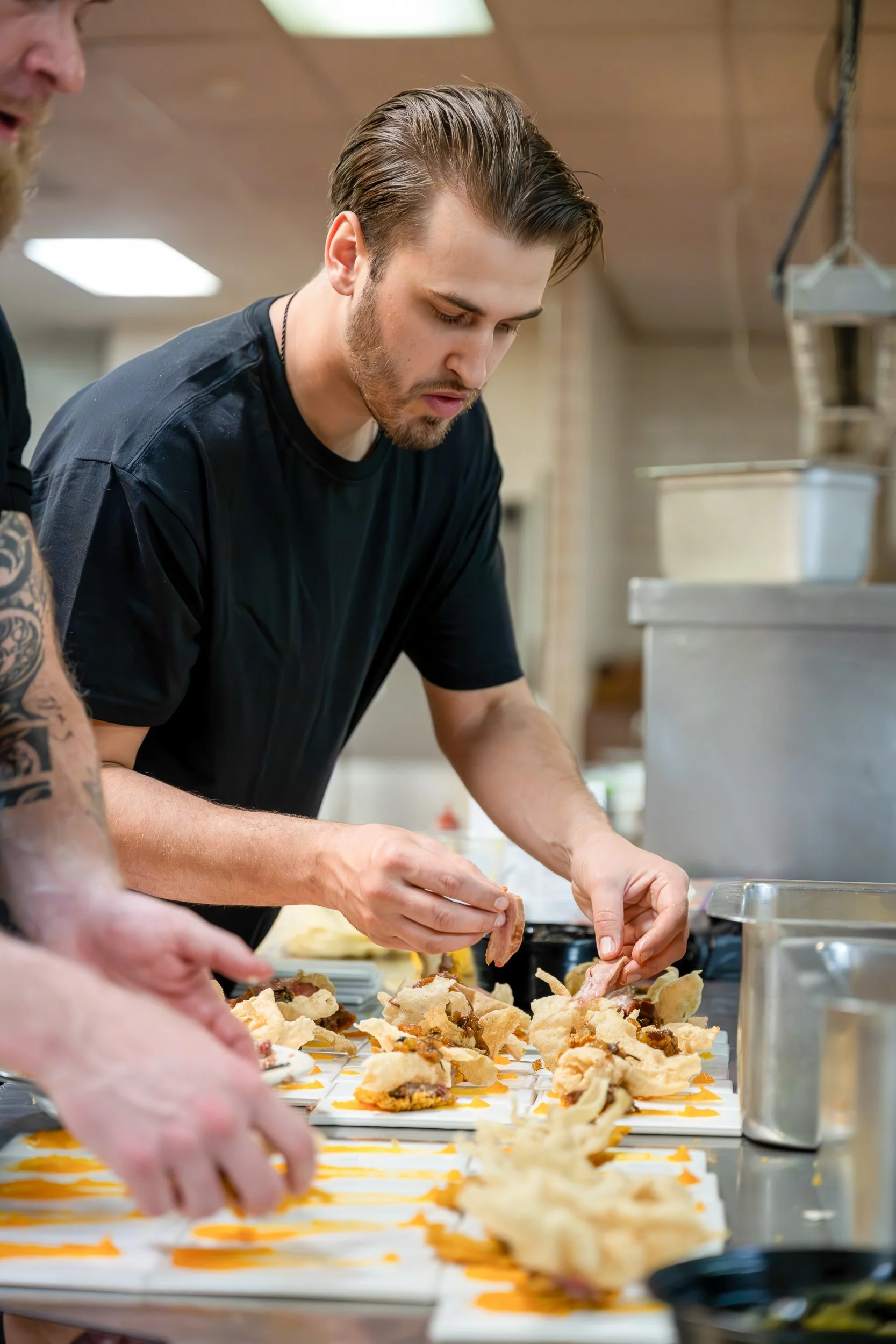 Chef composing dish at kitchen pass, restaurant kitchen and culinary photography
