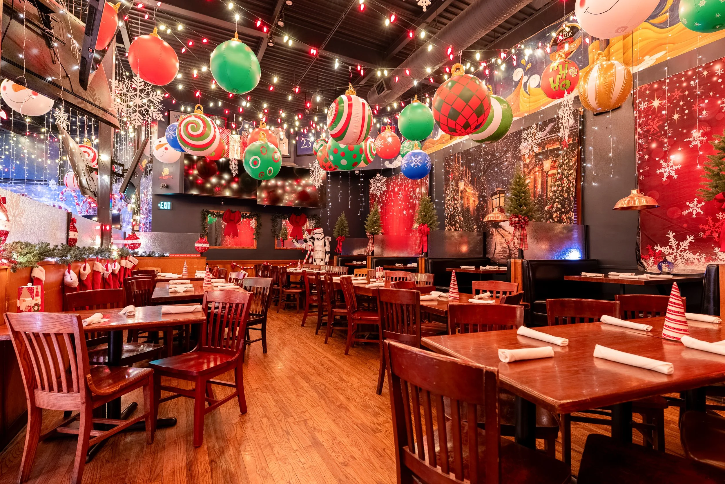 23rd Street Brewery dining room decorated for Christmas with ornament ceiling and warm light
