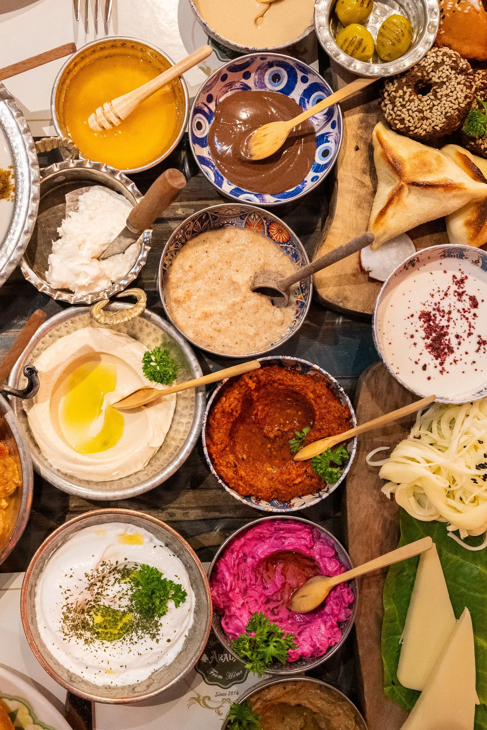 A collection of fresh breads, cheeses, and spreads captures the generosity and variety of a traditional Turkish breakfast.