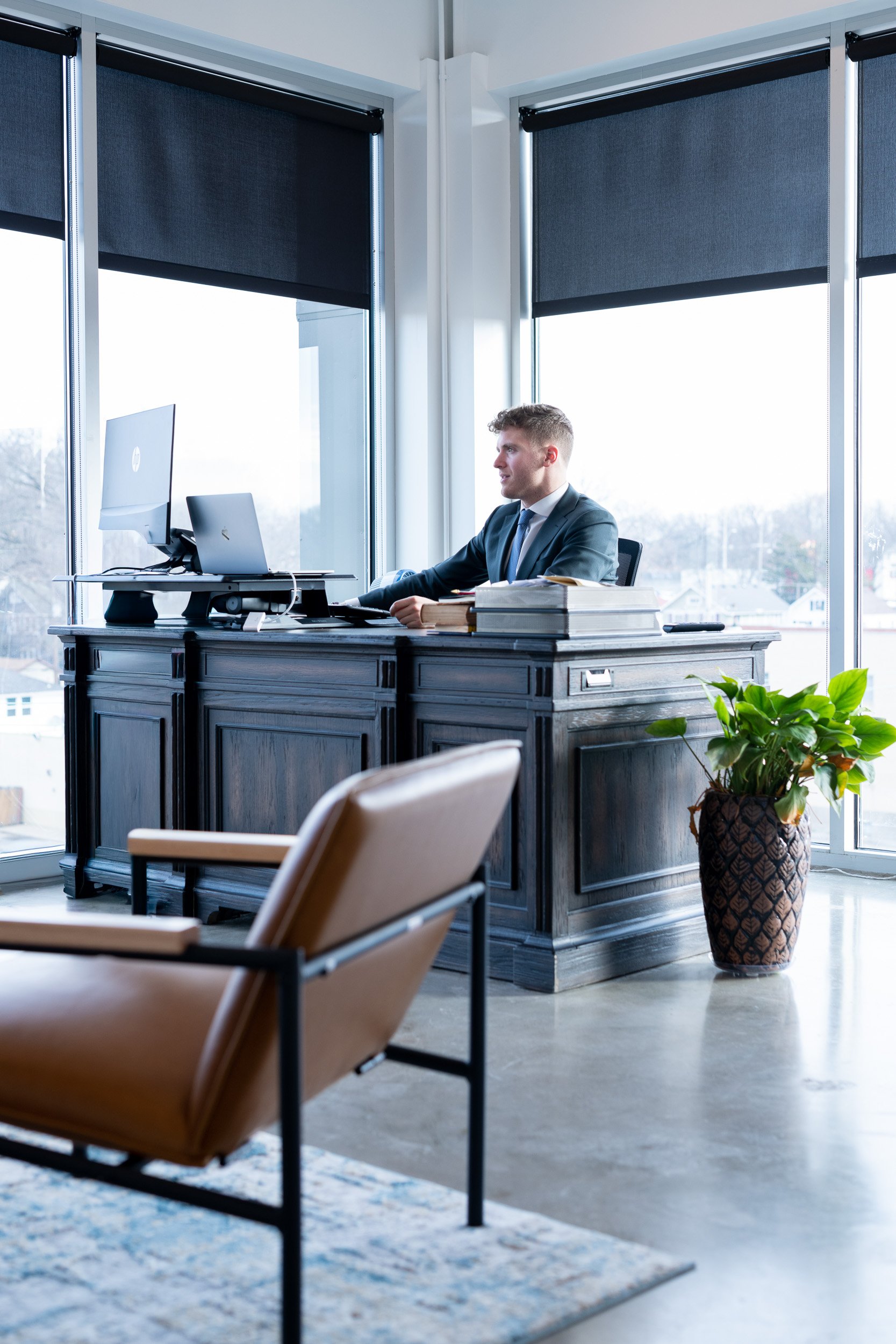 Kansas City commercial photographer Joe Zlatnik - attorney in corner office with floor to ceiling windows