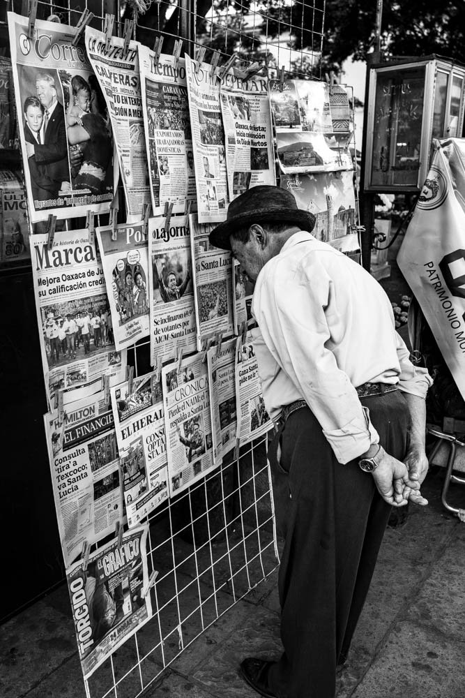 MAN READING NEWSPAPER, OAXACA, MEXICO.jpg