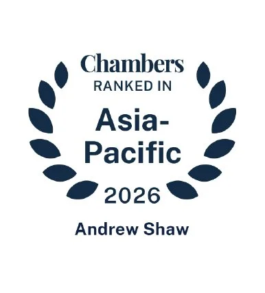 Award badge with laurel wreath design, text reading "Chambers Ranked in Asia-Pacific 2026," and the name "Andrew Shaw."