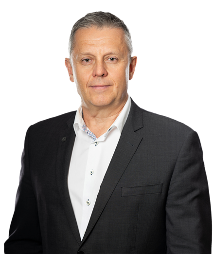 Portrait of Andrew Shaw Lawyer in a dark suit jacket and white shirt.