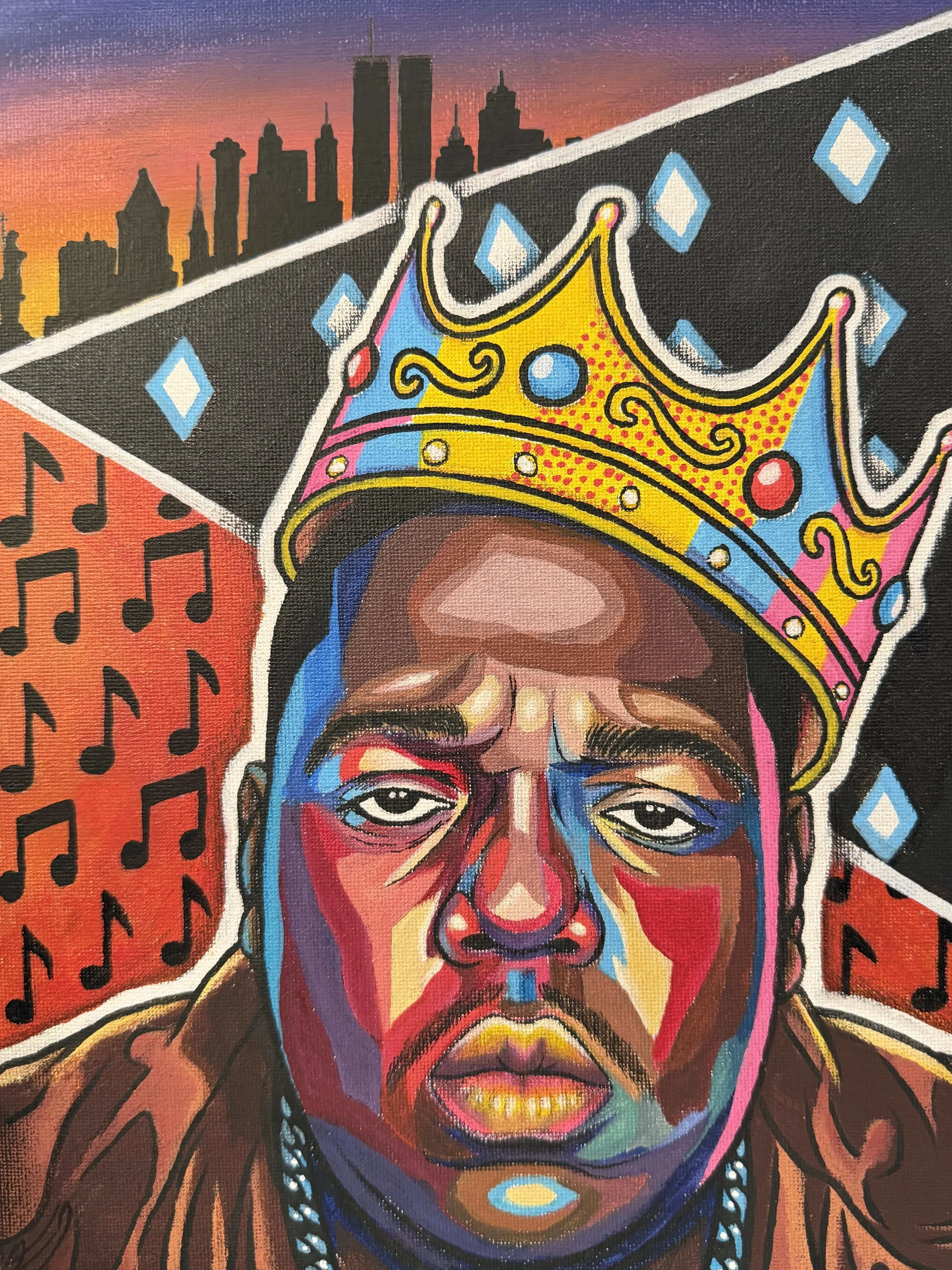 Colorful portrait of a man with tribal features, wears a crown, with a skyline at sunset in the background.