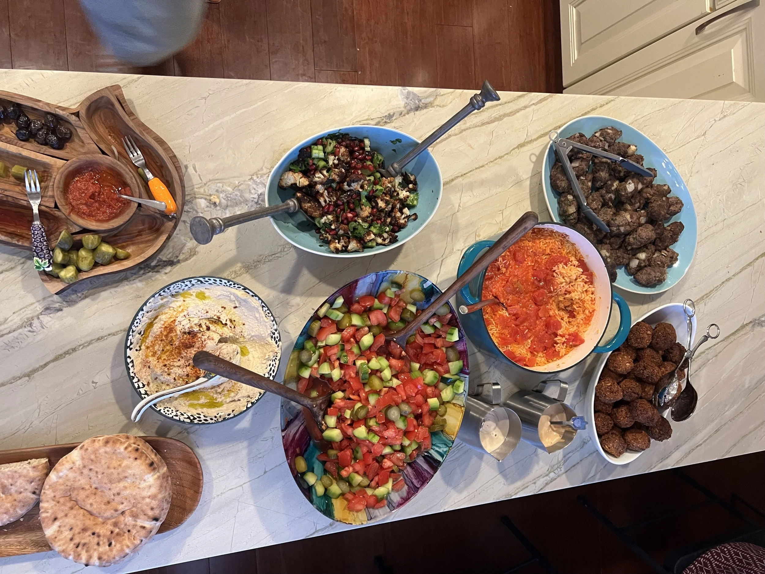 Falafel, Hummus, Cauliflower Salad, Tomato Salad, Beef Kebabs, and Red Rice
