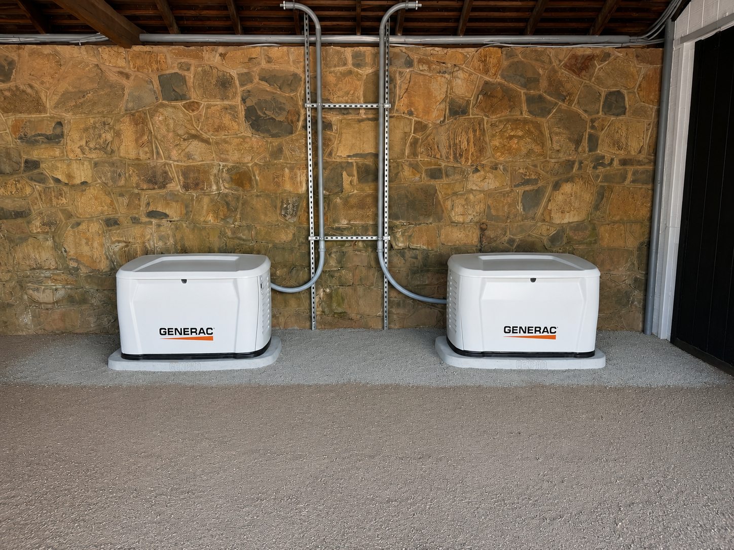 Two Generac standby generators installed outside of a home