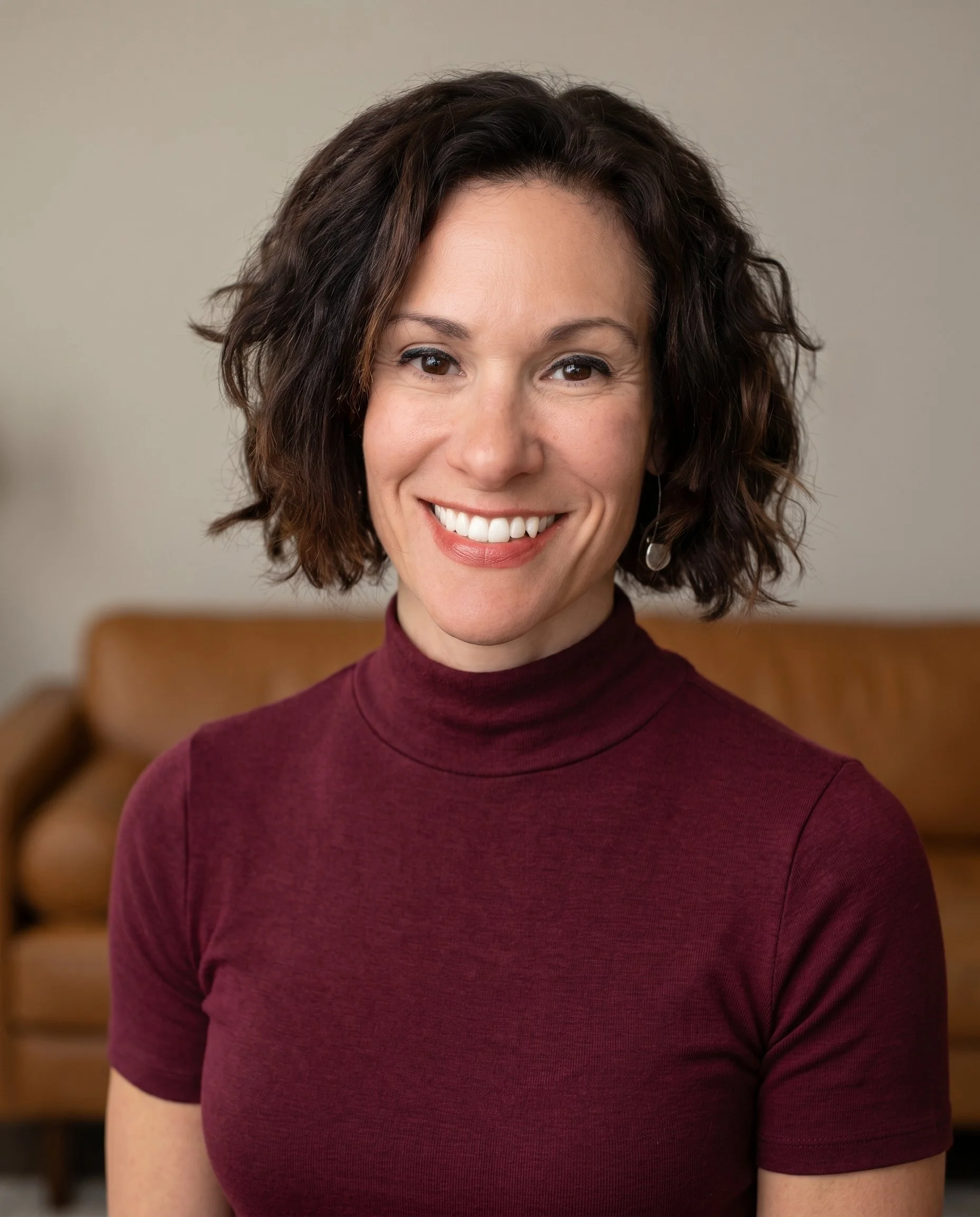Portrait of Lourdes Wiley, Registered Nurse and Licensed Massage Therapist.