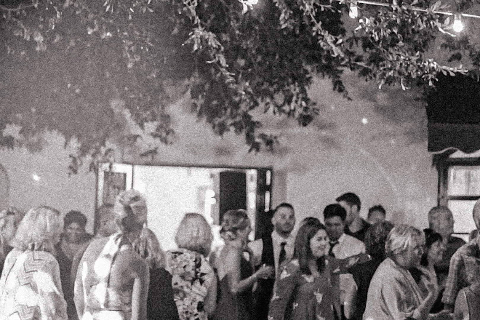 Liz & Kevin and wedding guests dance at their wedding at Orcutt Ranch, Northridge
