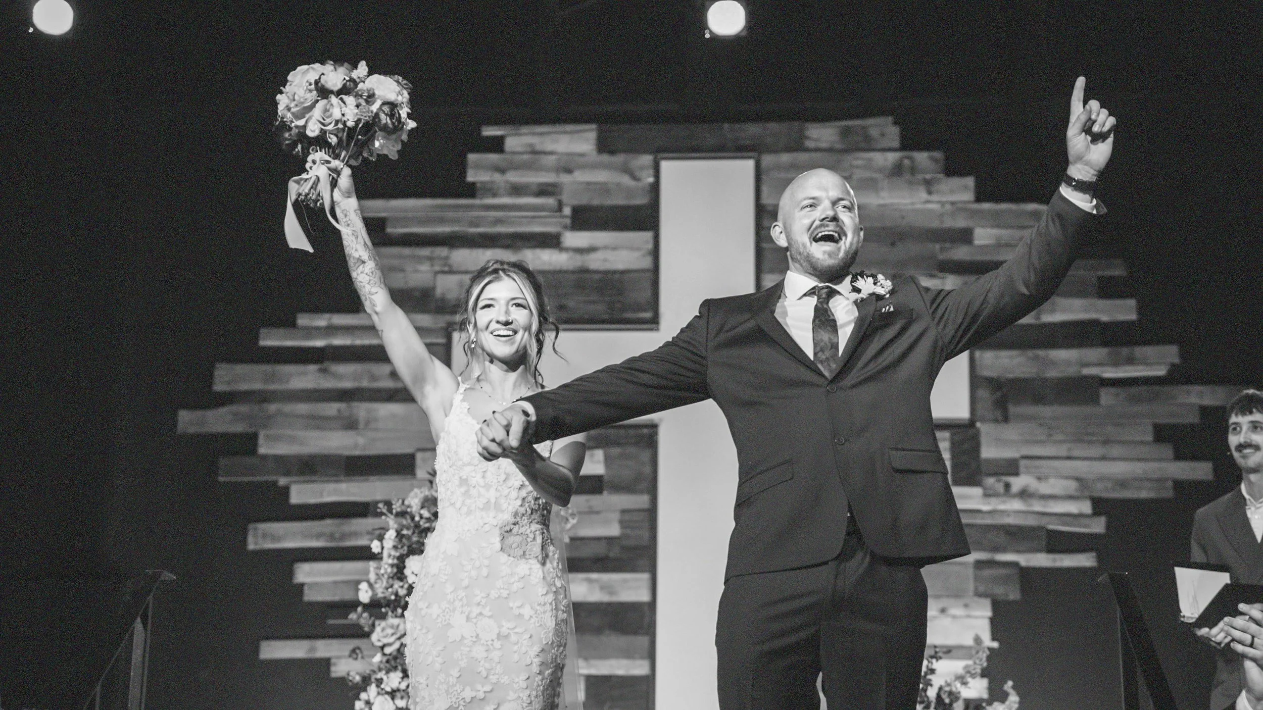 Black-and-white photograph of newlyweds Gabriella and Cullen celebrating their wedding ceremony in Santa Clarita, California.