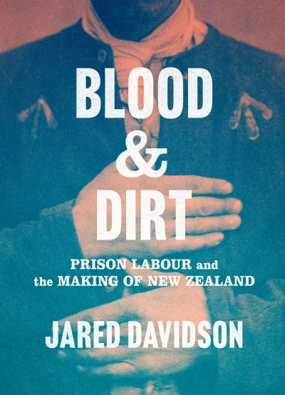Book cover titled 'Blood & Dirt: Prison Labour and the Making of New Zealand' by Jared Davidson. The background features a person with hands crossed over their chest, wearing a dark jacket and a white scarf.