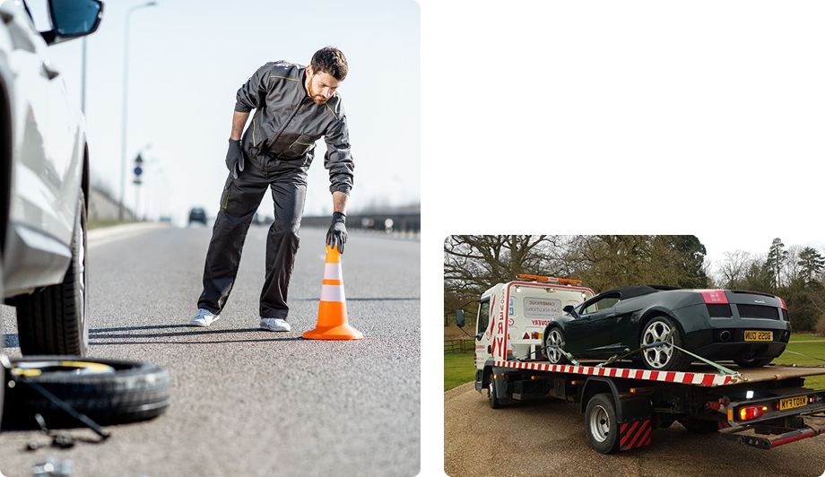 A man in a gray jumpsuit and gloves setting up a traffic cone on an open road near a white car, which has a flat tire, with a tire and tools nearby. In another part of the image, a black sports car on a flatbed tow truck parked on a grassy area.