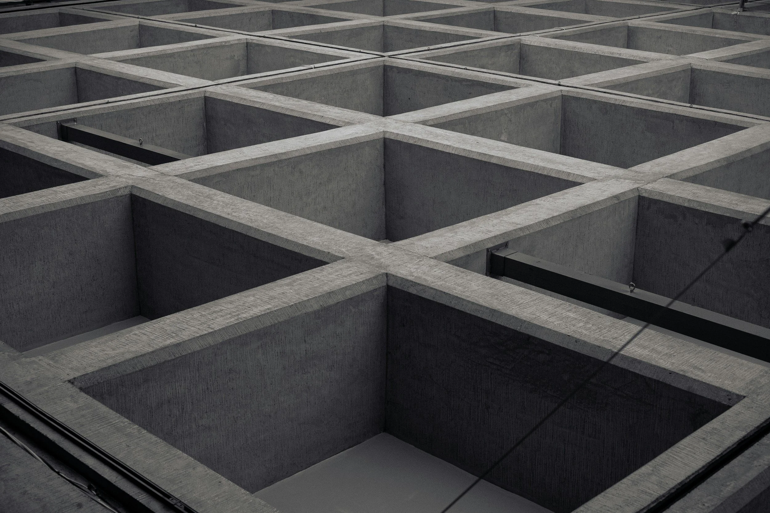 View of a memorial wall with empty square compartments.