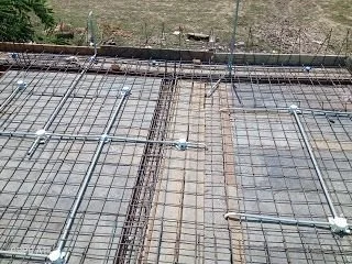 Construction site with reinforced steel rebar on a concrete slab