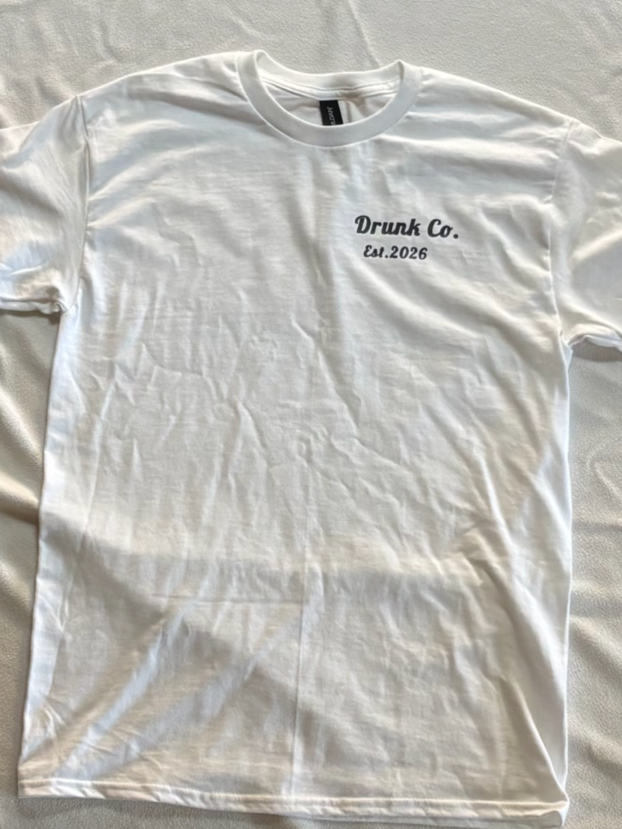 White T-shirt with black text that reads "Drunk Co. Est. 2026" positioned on the upper left side of the shirt.