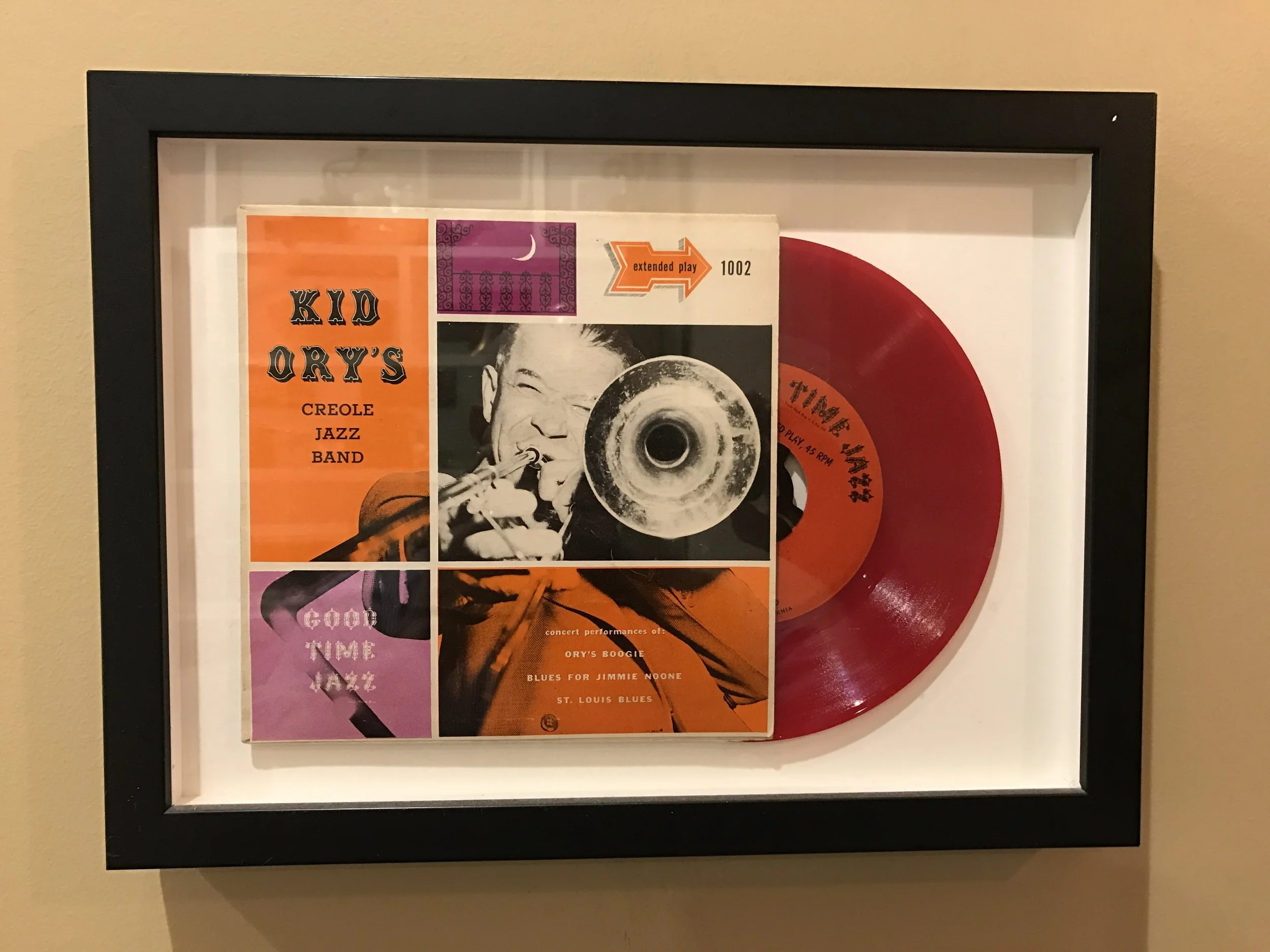 Framed Kid Ory's Creole Jazz Band LP displayed with a red vinyl 45 RPM single
