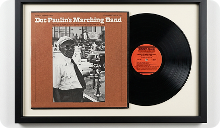 Framed Doc Paulin's Marching Band LP displayed with its record