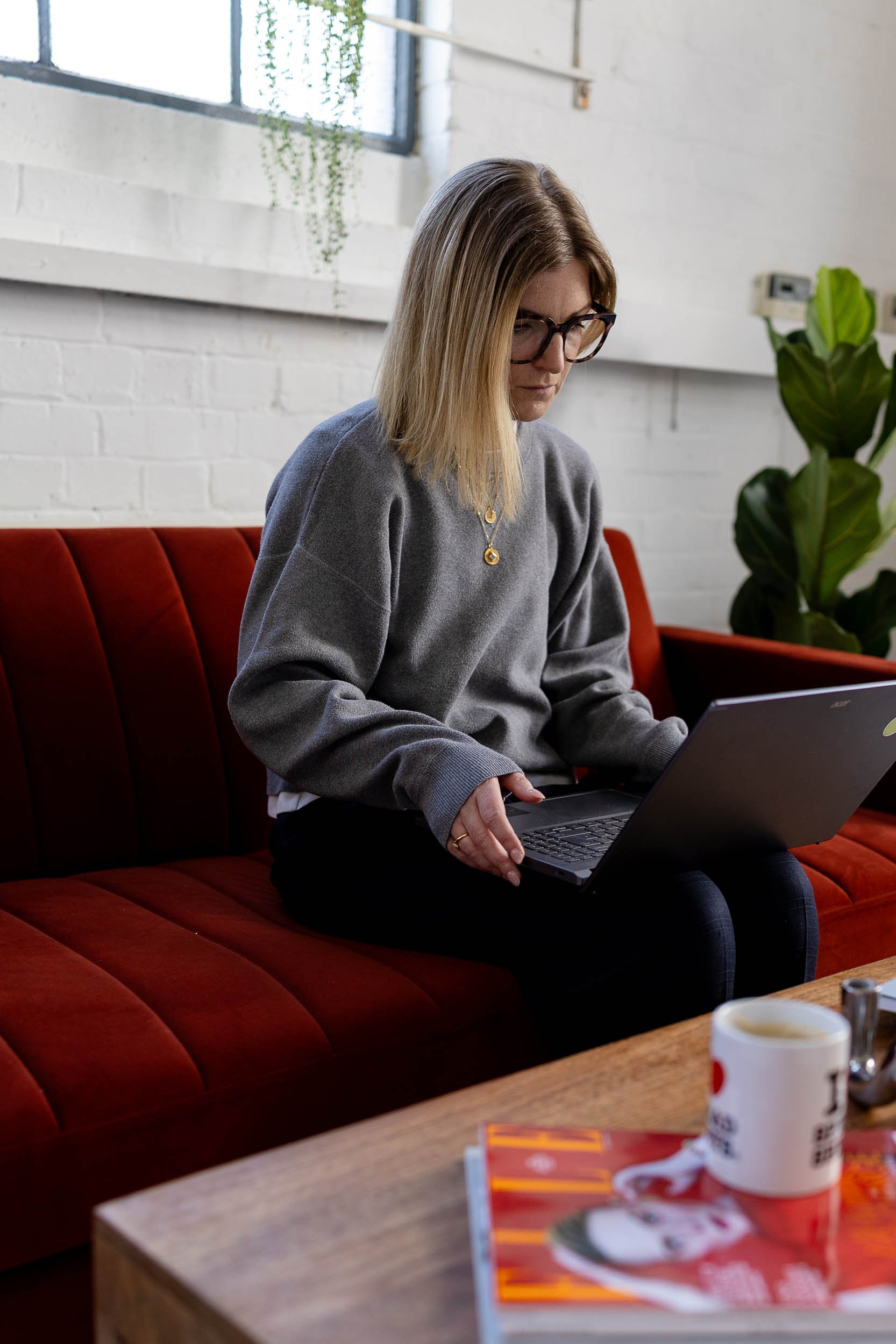 Merchandising consultant working on laptop
