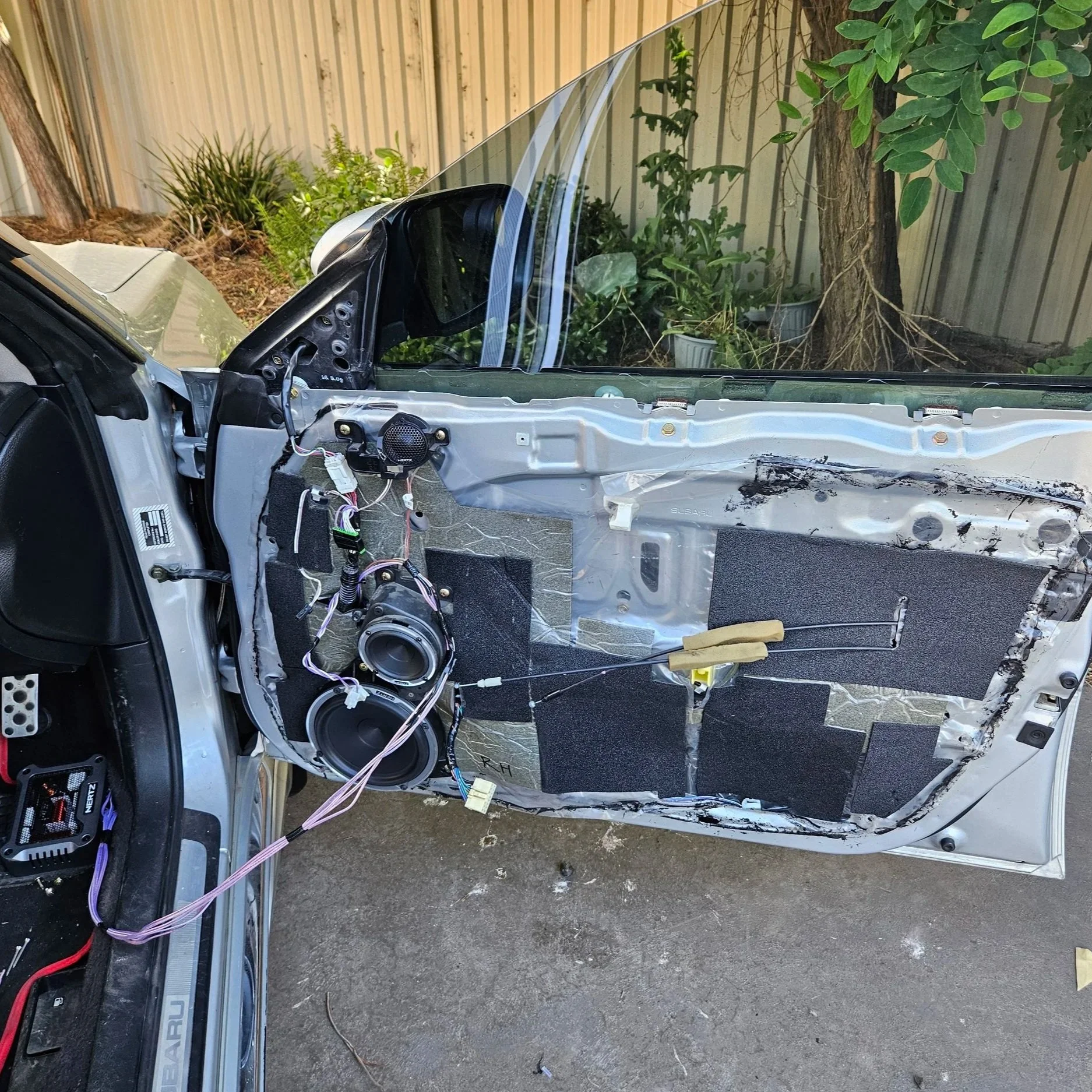 Interior of a door panel showing upgraded speakers.