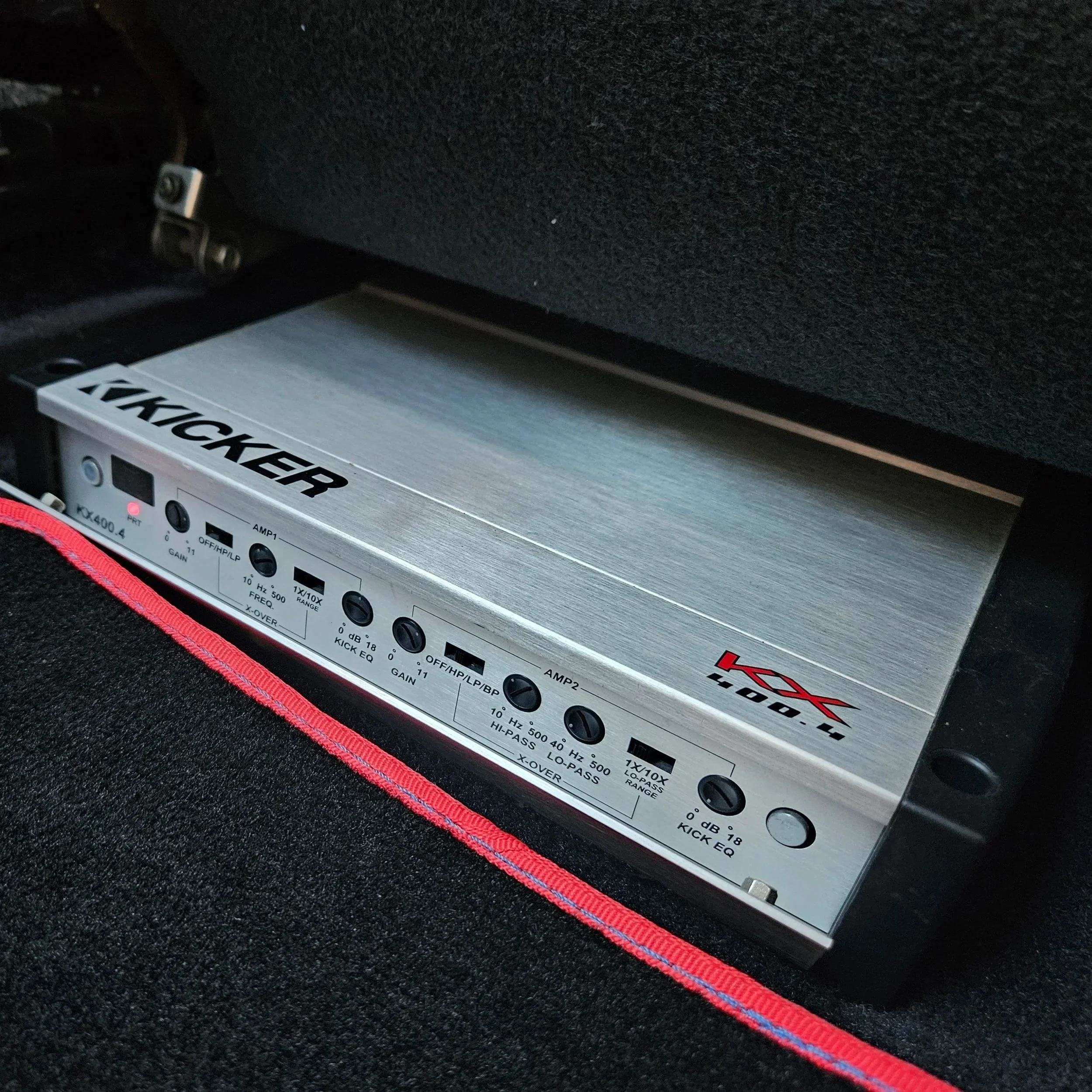 Amplifier installed under the passengers seat for optimum space use.