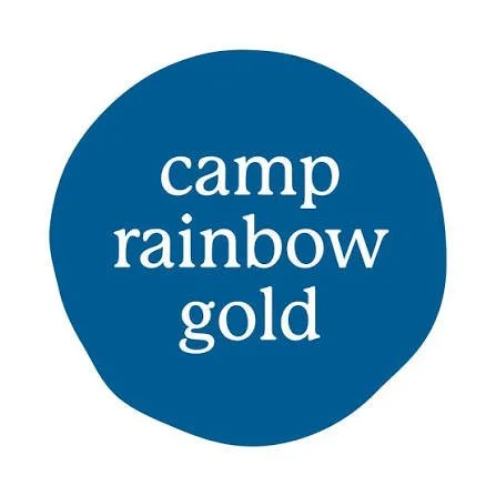 Blue circle with white text that says 'camp rainbow gold'.