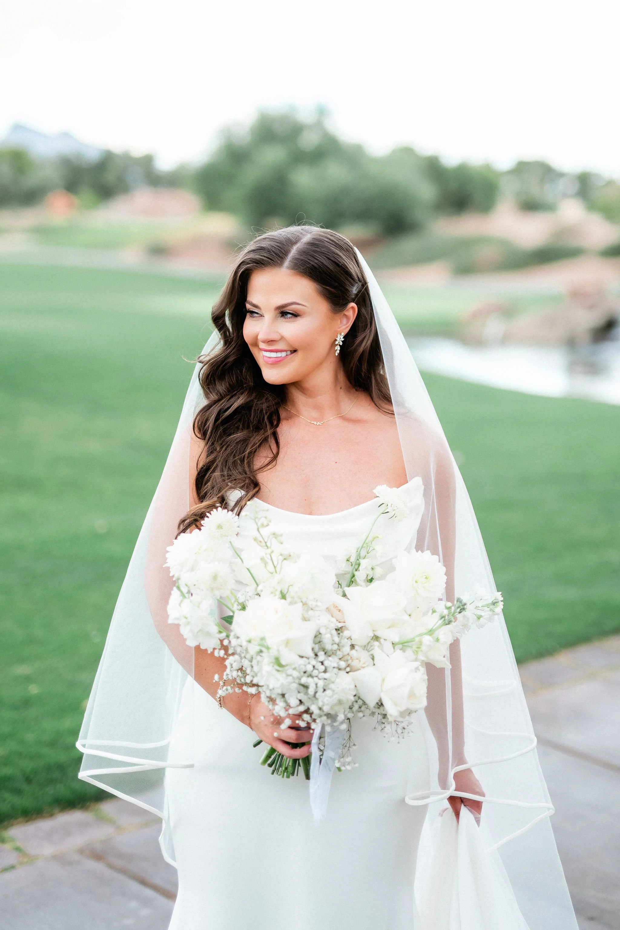Editorial bridal portrait with voluminous waves and veil at Canyon Gate Country Club Las Vegas, hair and makeup by Marai A for Amelia C & Co, photography by Kristen Marie Weddings
