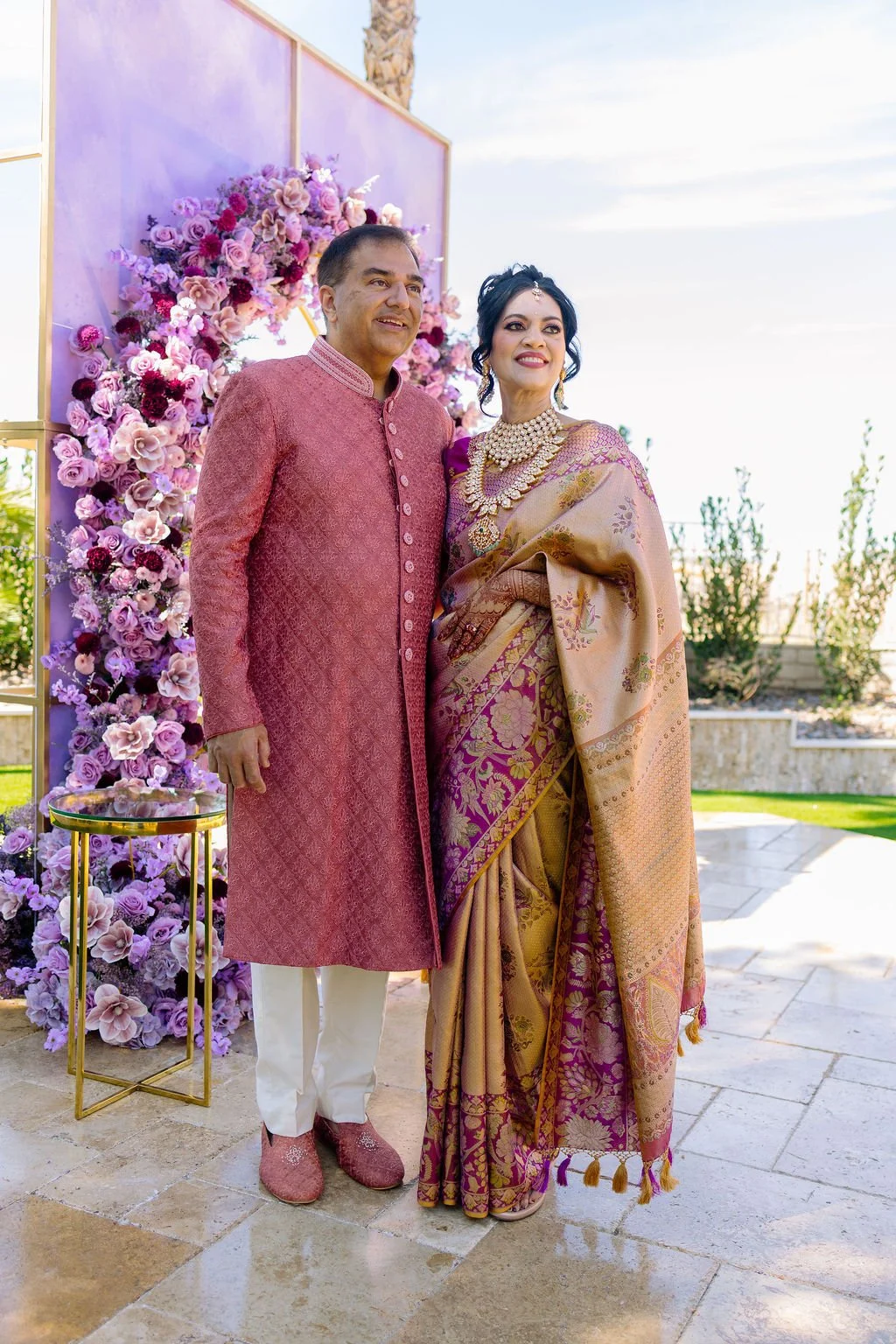 Couple in traditional Indian attire at Las Vegas engagement celebration, hair and makeup by Amelia C & Co, photography by Elizabeth Burgi, planning by Scheme Events