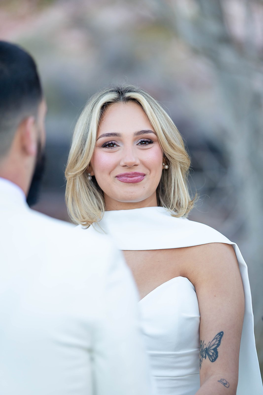 Melysa emotional during vows at Red Spring Boardwalk Las Vegas elopement ceremony, hair by Luci and makeup by Natalia for Amelia C & Co, photography by Onyx & Arrow
