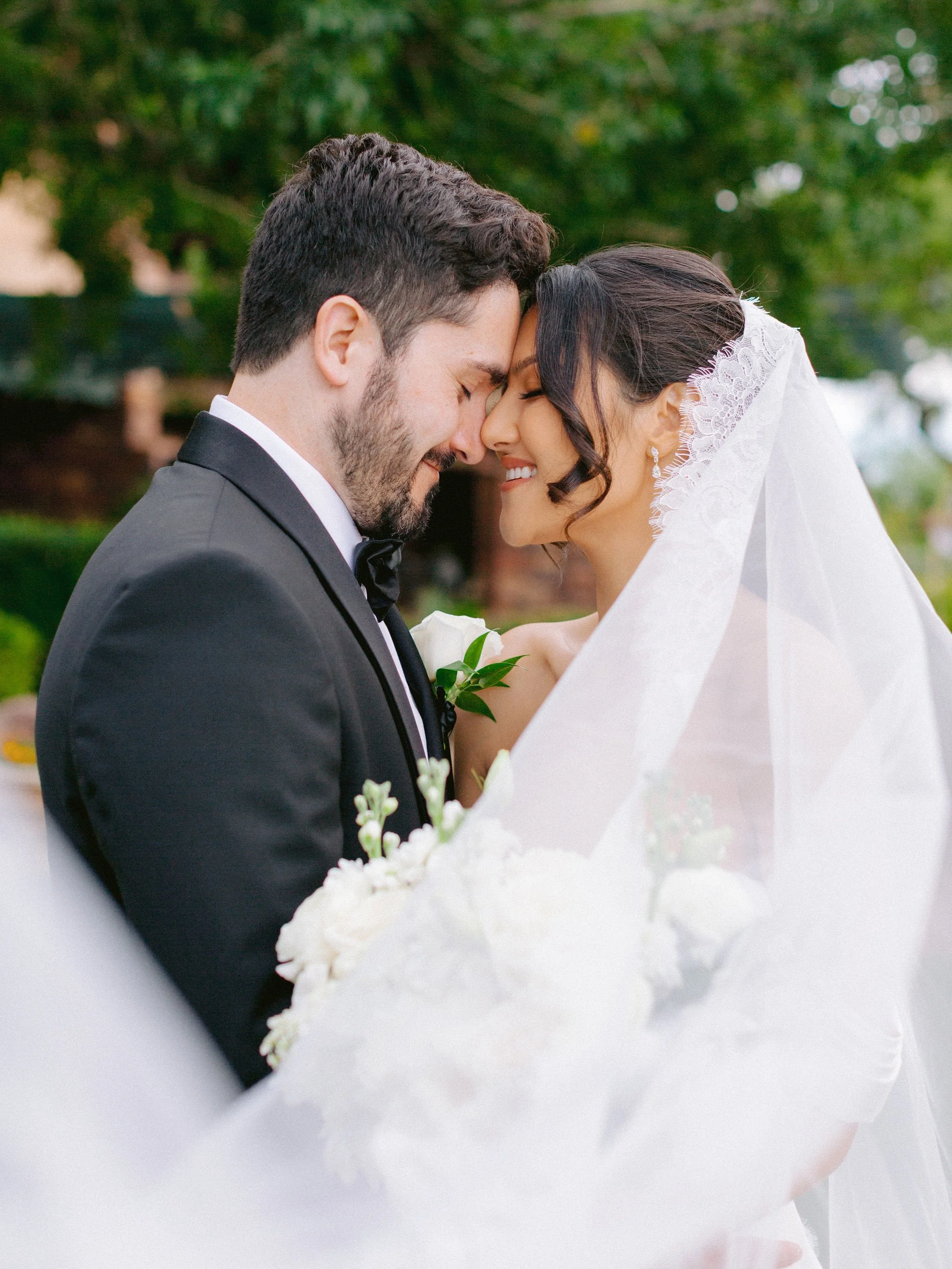  Intimate couple portrait with lace veil wrapped around bride and groom at Las Vegas Paiute Golf Resort wedding, hair by Kari K and makeup by Natalia W for Amelia C & Co, photography by Susie and Will